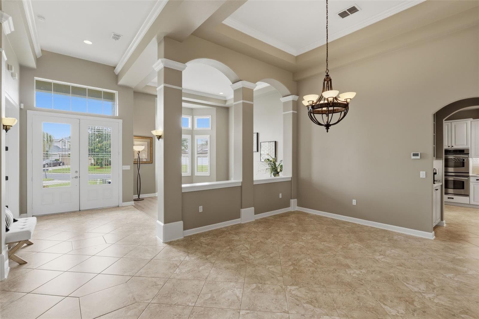 Foyer with scones and overhead ambient lighting. - 426 DUFF DR, WINTER GARDEN