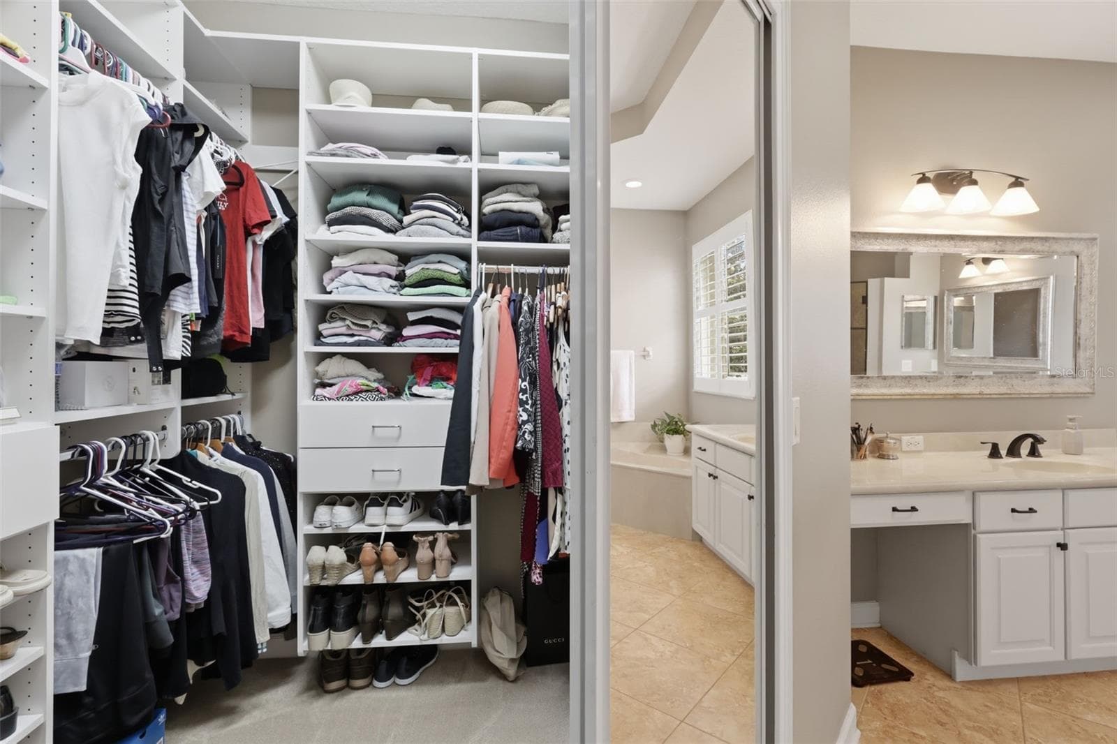 One of the 2 primary bedroom custom closets. - 426 DUFF DR, WINTER GARDEN