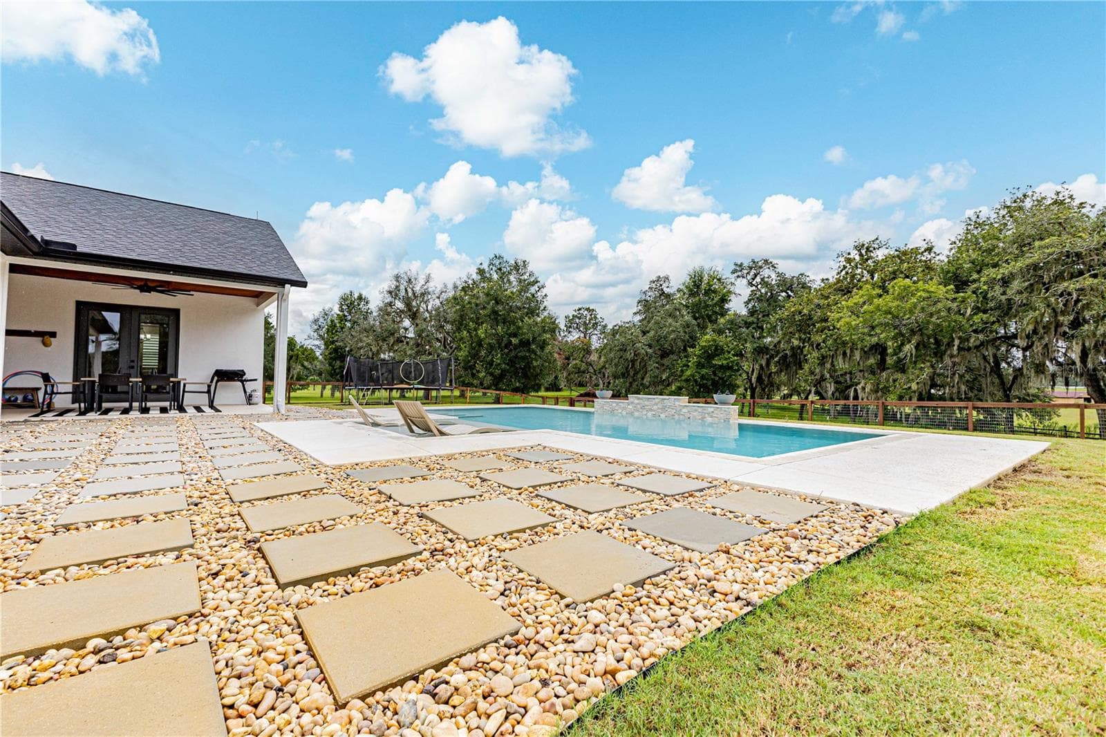 Pool with entertainment area - 8818 SW 73RD PATH, BUSHNELL