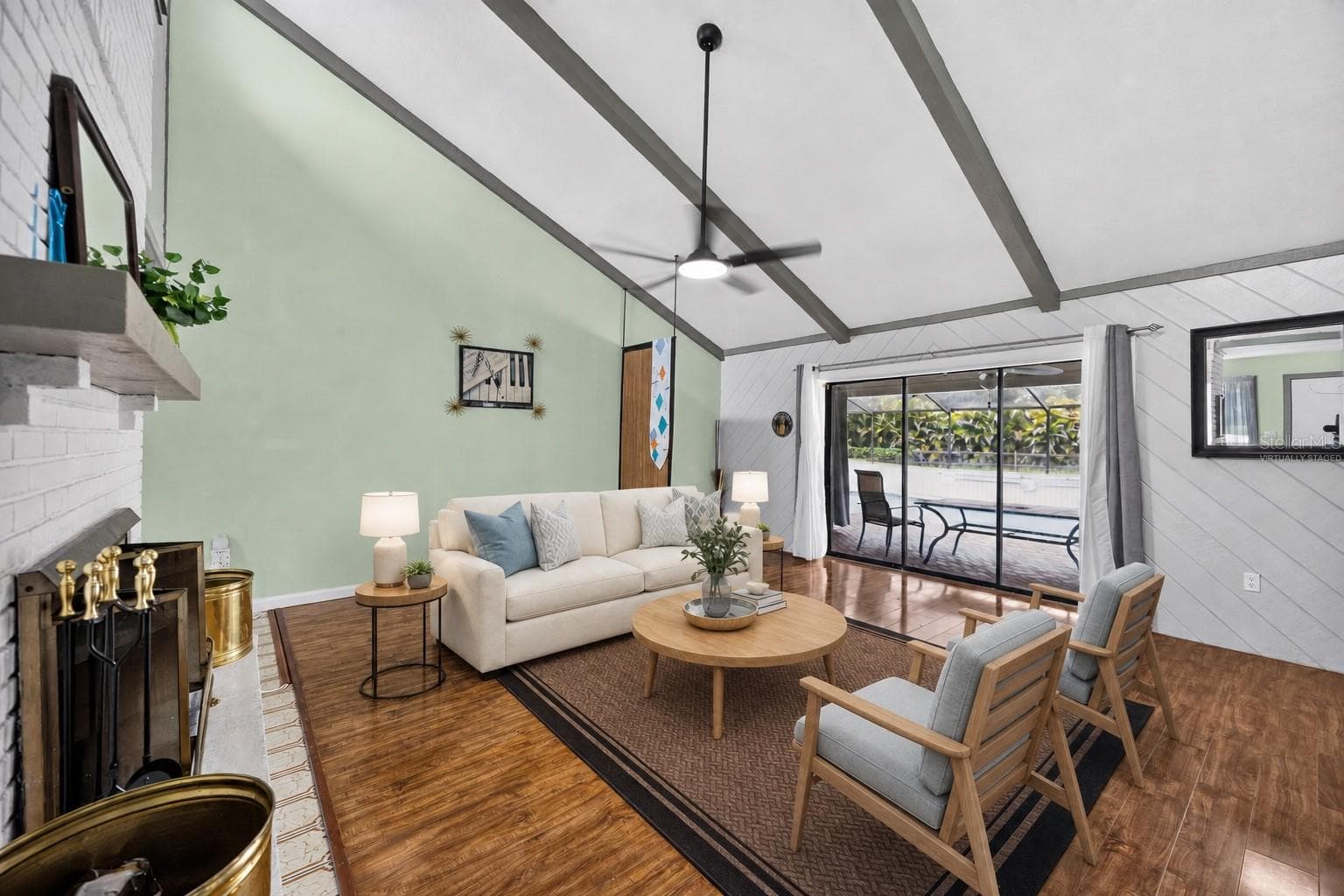 Virtually staged - Great room seating arranged around the fireplace. - 1305 GREENFIELD CIR, VENICE
