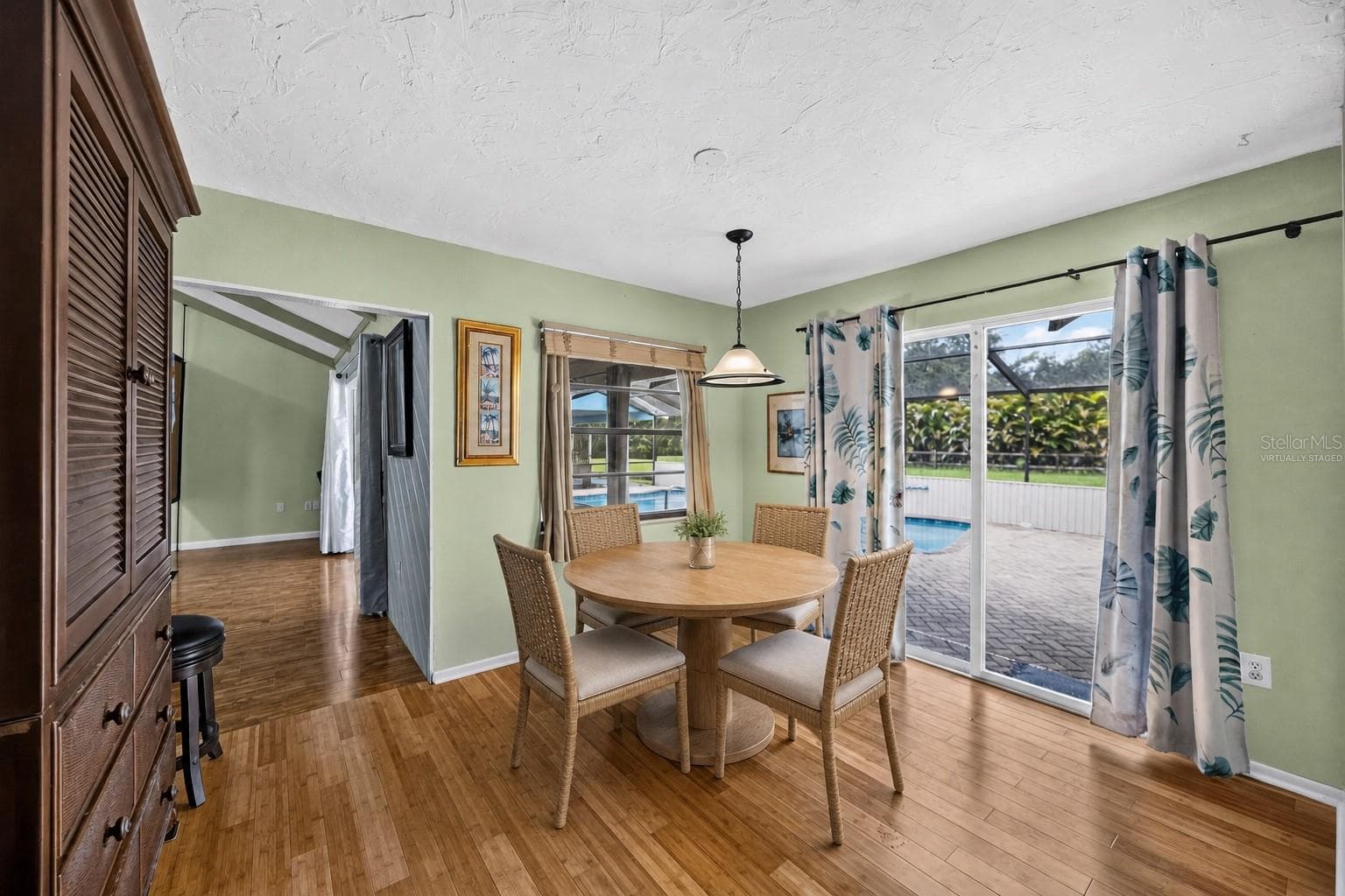 Virtually staged - Breakfast area with pool views. - 1305 GREENFIELD CIR, VENICE