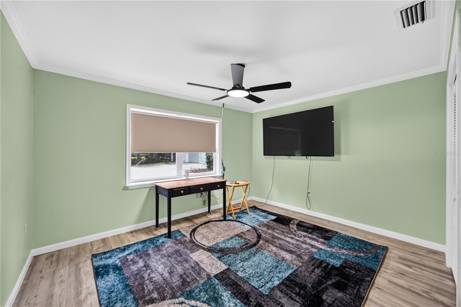 Home office or den with TV and area rug. - 1305 GREENFIELD CIR, VENICE