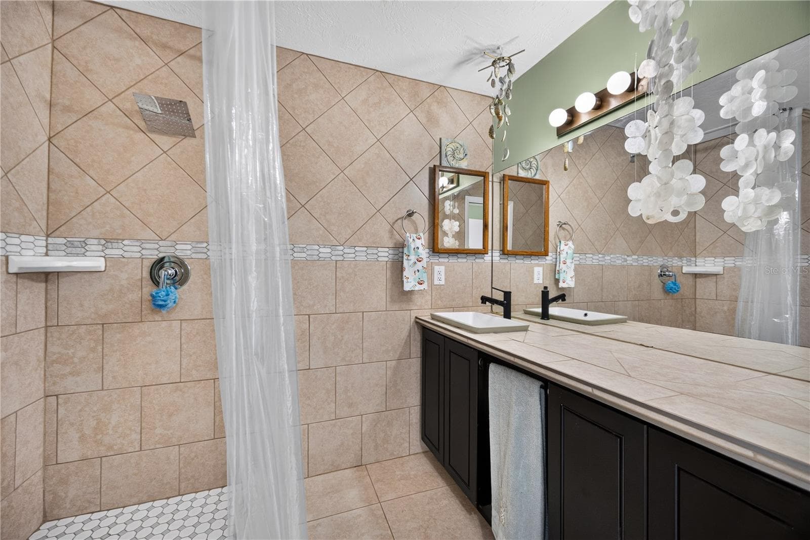 Shower with tile surround. - 1305 GREENFIELD CIR, VENICE
