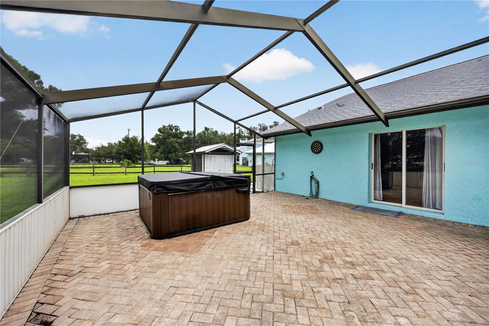 Outdoor bar and entertainment area by the pool. - 1305 GREENFIELD CIR, VENICE