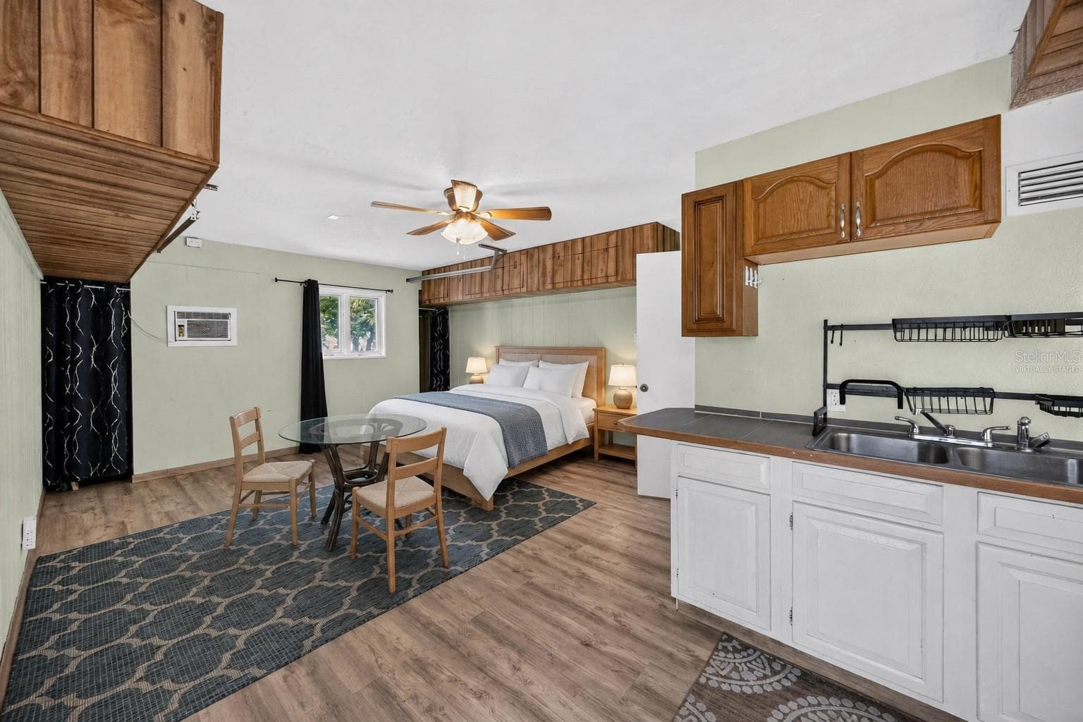 Virtually staged - Downstairs studio sleeping area with kitchenette. - 1305 GREENFIELD CIR, VENICE