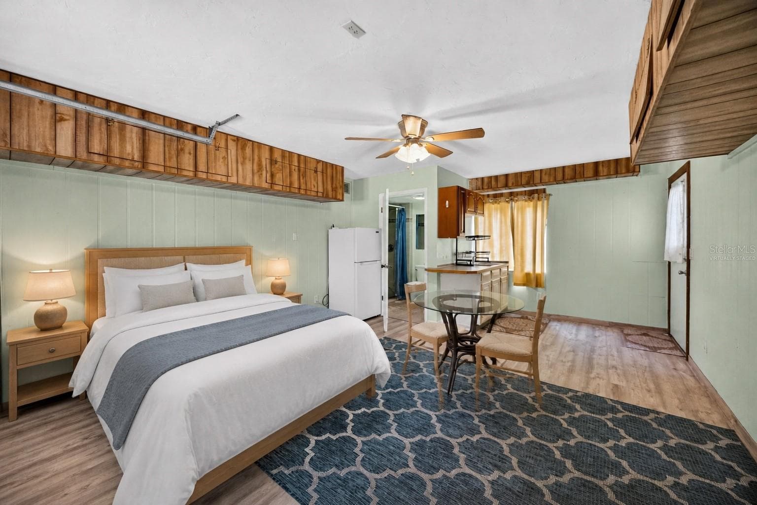 Virtually staged - Downstairs studio sleeping area and dining space. - 1305 GREENFIELD CIR, VENICE