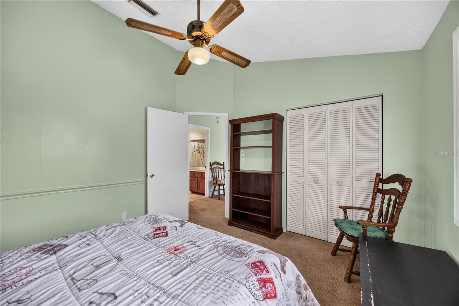 Upstairs bedroom with closet and sitting area. - 1305 GREENFIELD CIR, VENICE