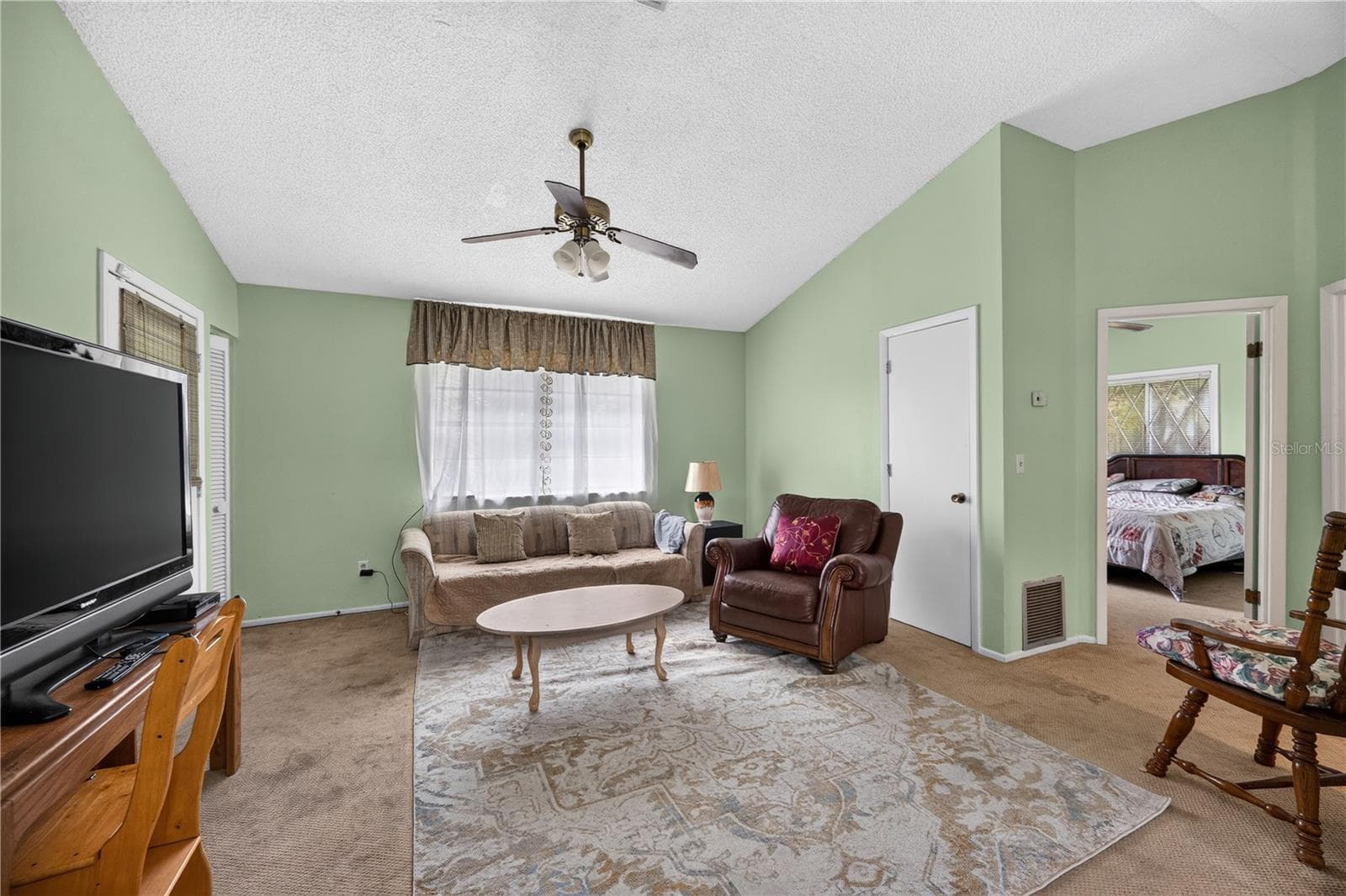 Upstairs living room with abundant natural light. - 1305 GREENFIELD CIR, VENICE