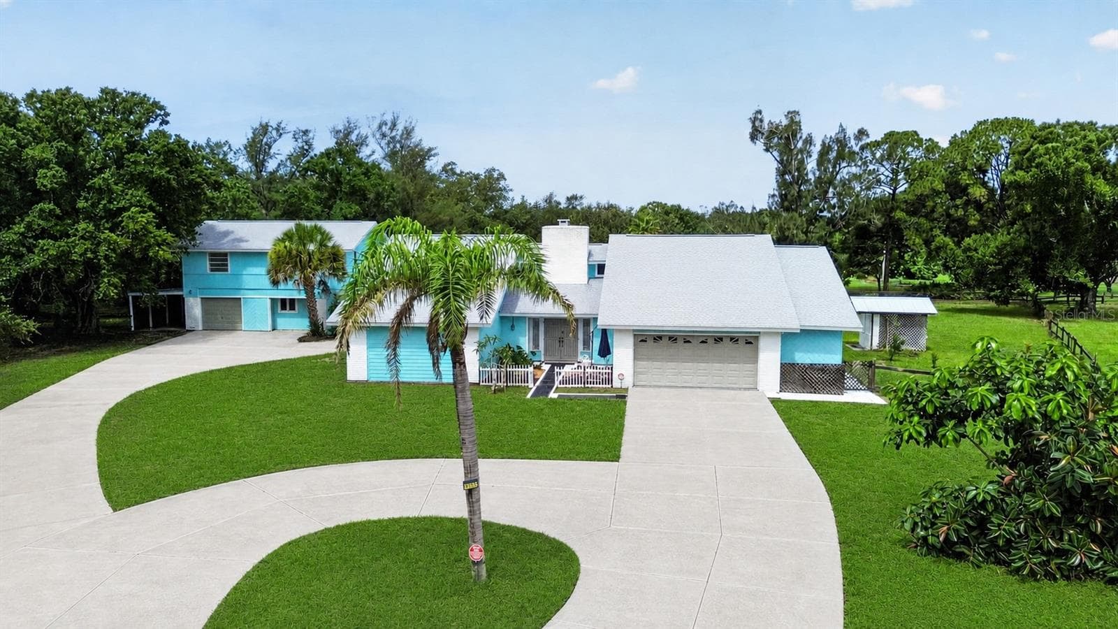 Front aerial view of the home and grounds. - 1305 GREENFIELD CIR, VENICE