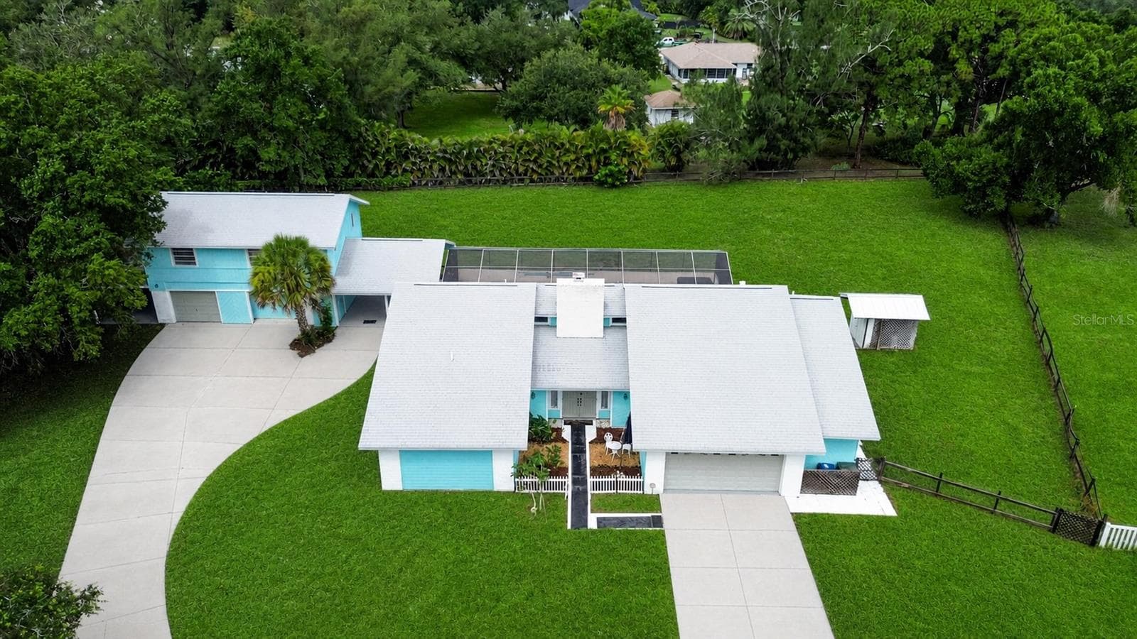 Aerial view of the home and circular driveway. - 1305 GREENFIELD CIR, VENICE