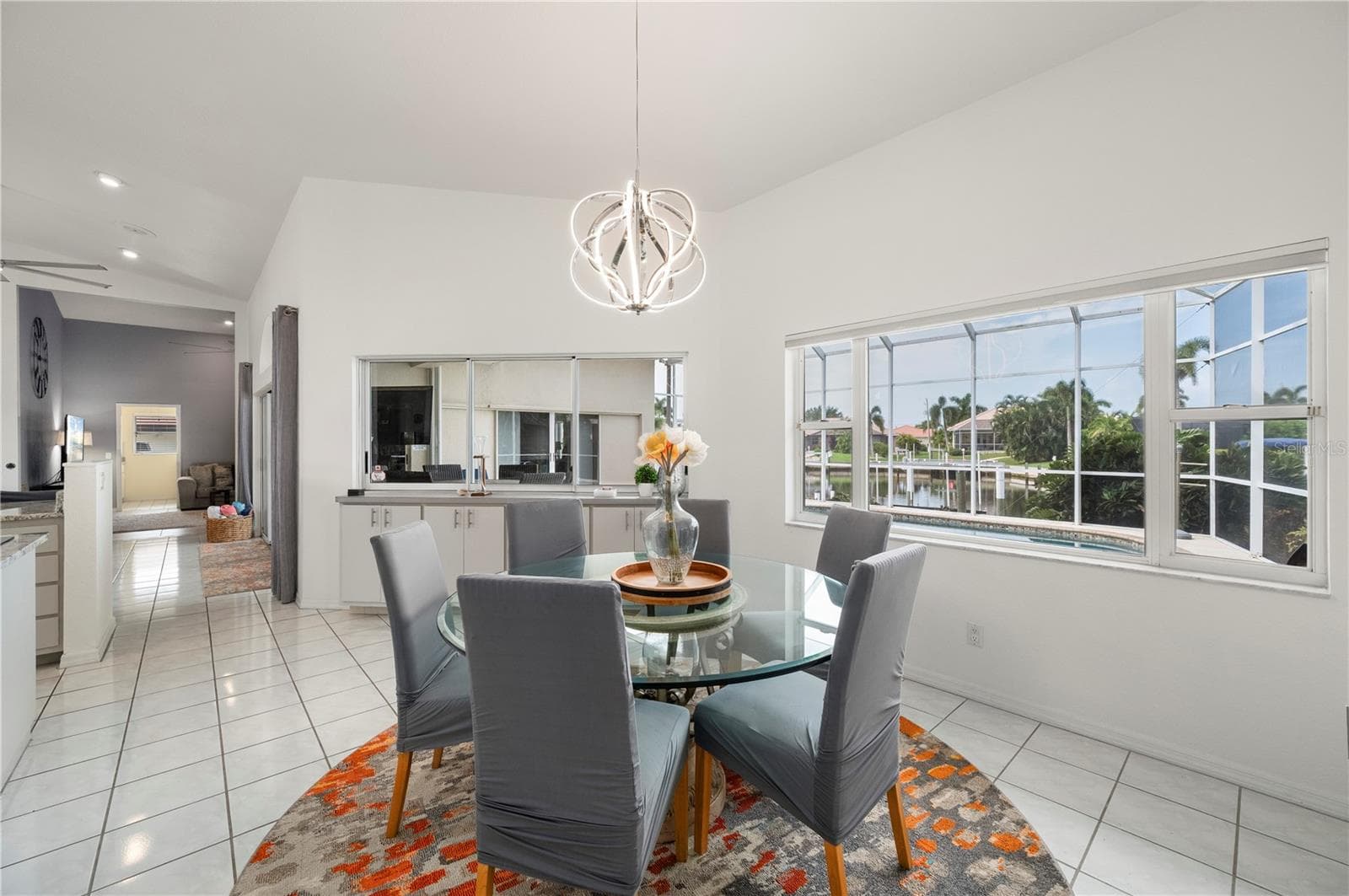 Dining with extra cabinets, views of pool and dock - 265 BELVEDERE CT, PUNTA GORDA