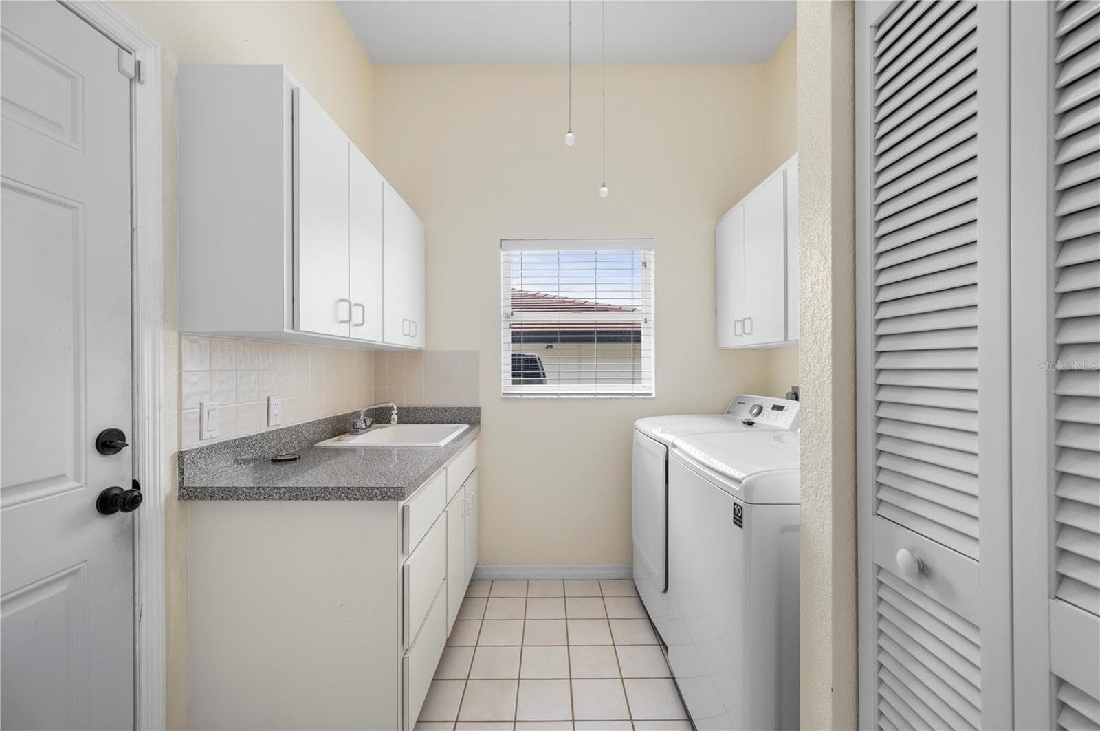 Inside laundry, well appointed storage & garage access - 265 BELVEDERE CT, PUNTA GORDA