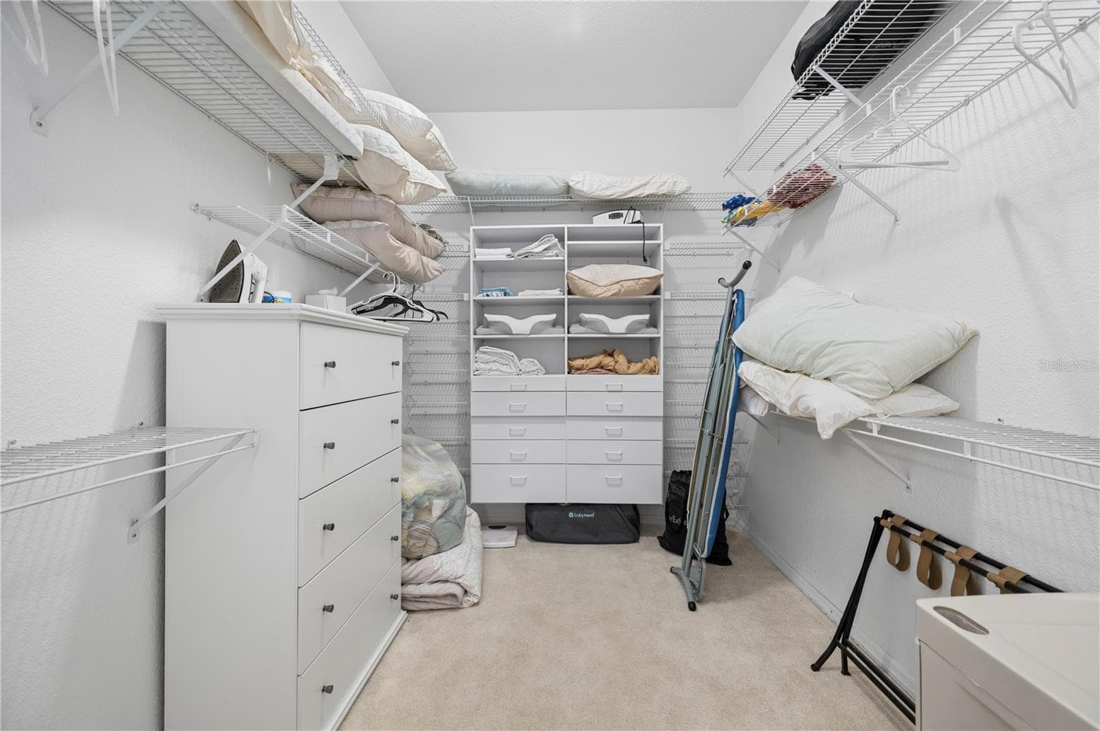 Walk-in closet with built-in storage - 265 BELVEDERE CT, PUNTA GORDA