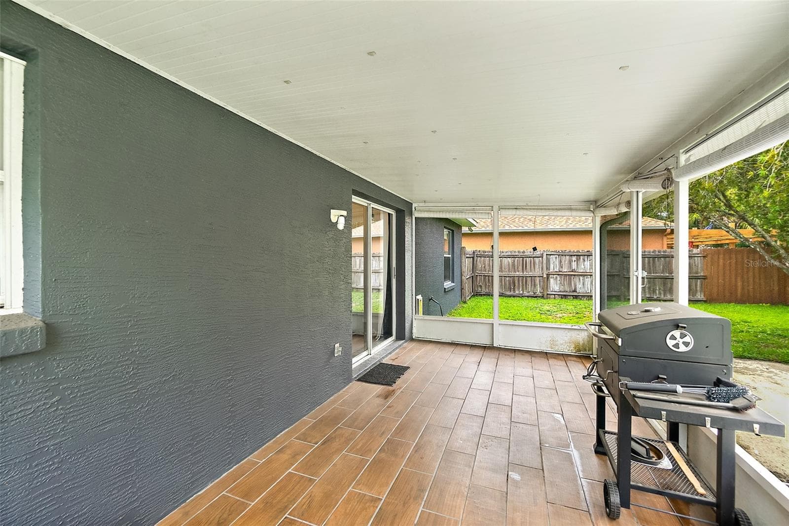 Covered & Screened Rear Patio - 17 PINELARK LN, PALM COAST