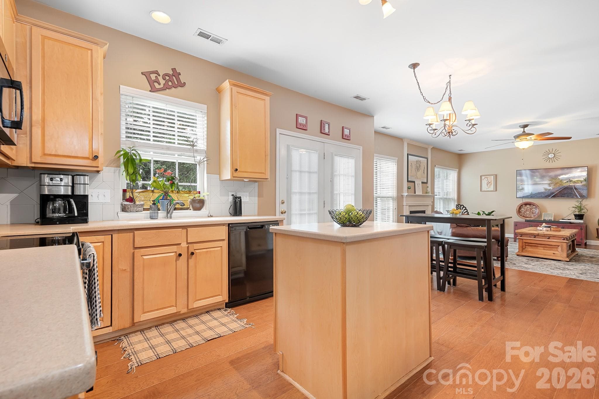 Kitchen has wood floors and lots of natural light - Fort Mill