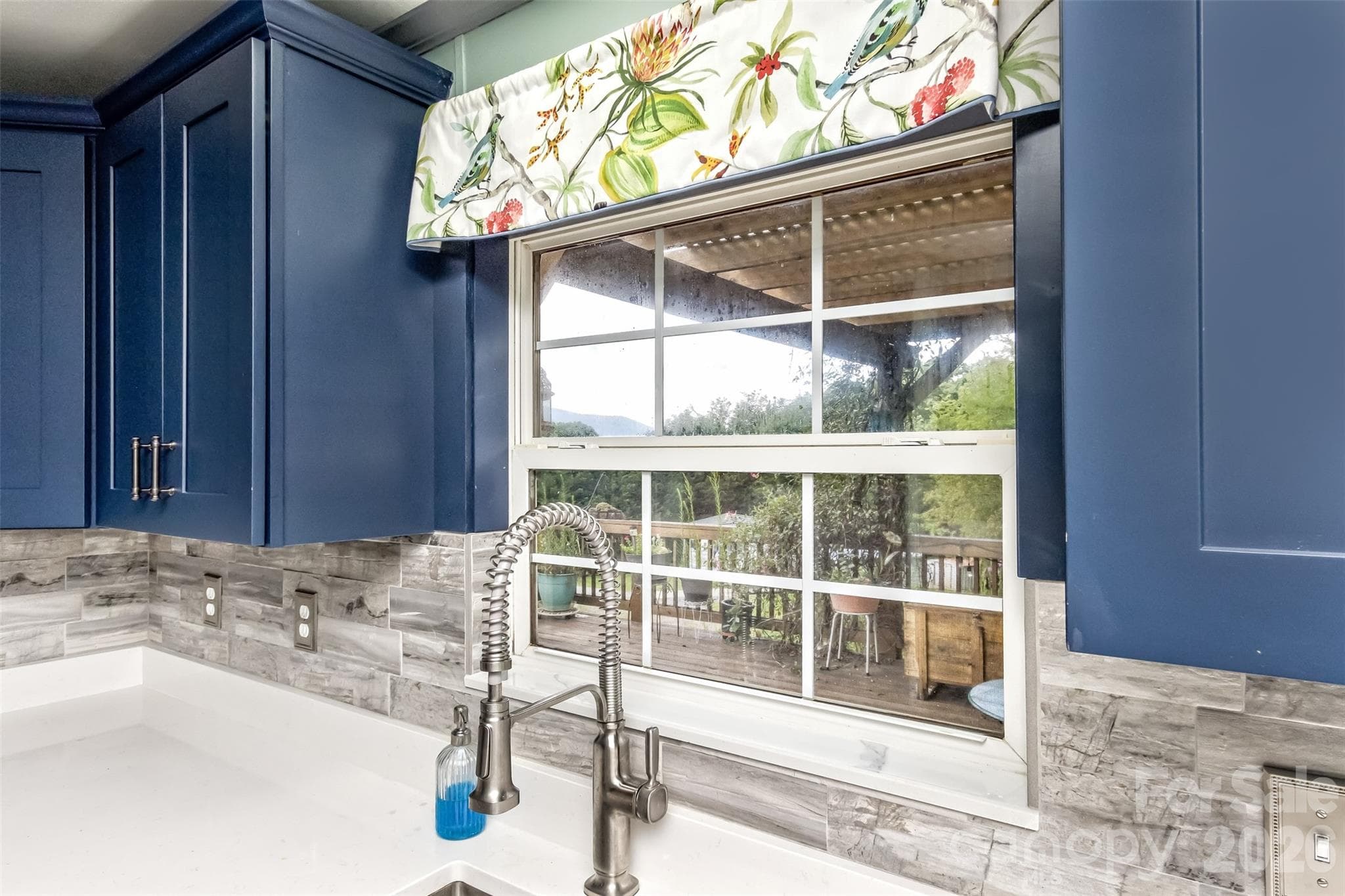 kitchen sink with window out to deck and mountain views - 25 Asa Court, Black Mountain