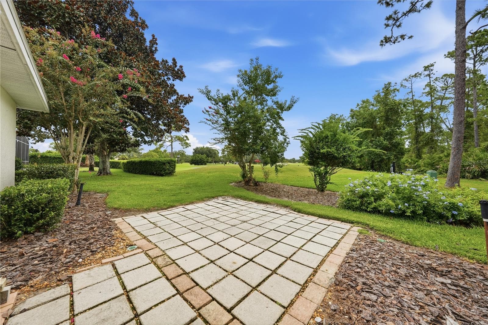 Unwind with serene views overlooking the 8th tee. - 2360 PARK FOREST BLVD, MOUNT DORA