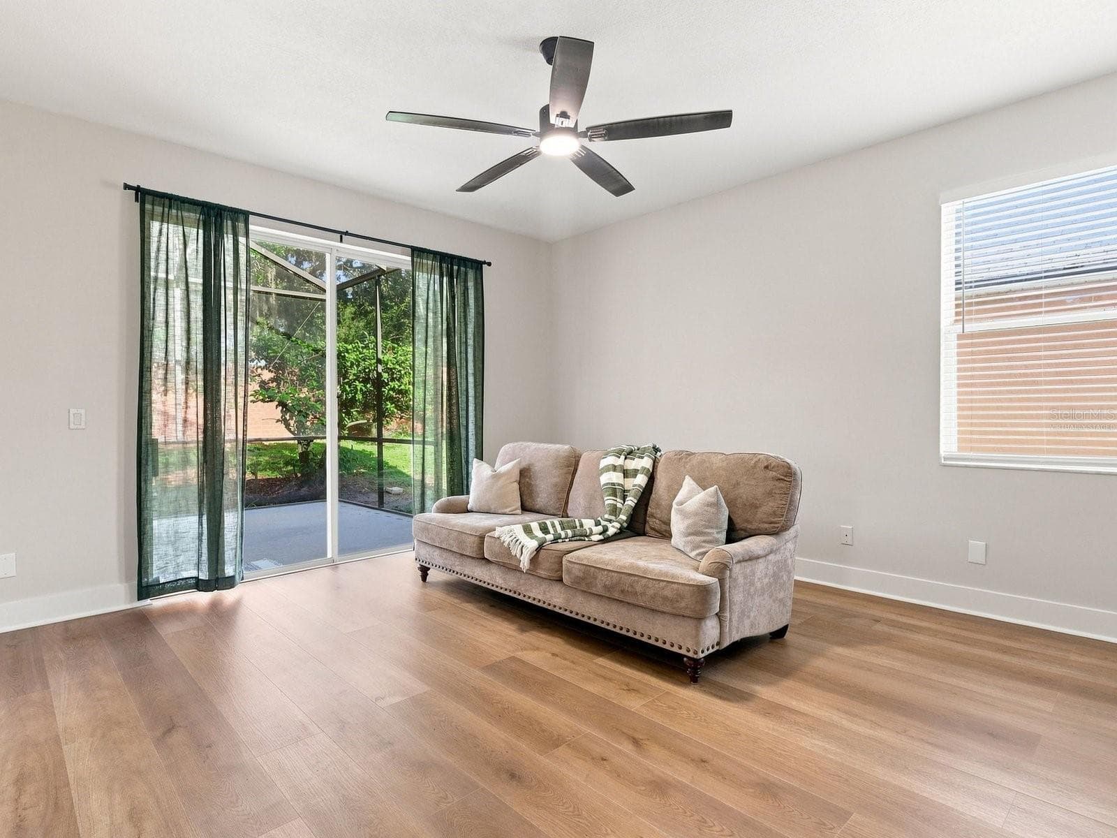 Family Room (Select photos have been virtually staged) - 2104 MALLARD CREEK CIR, KISSIMMEE