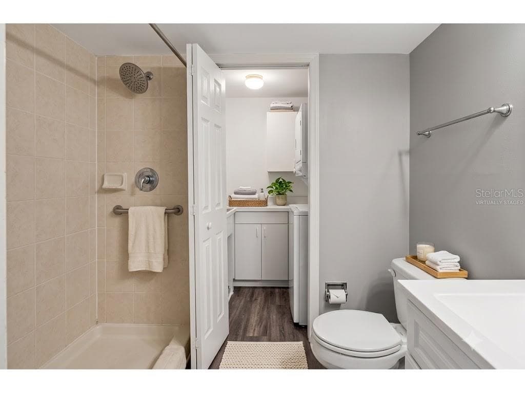 Virtually Staged First Floor bathroom, and Laundry - 14521 CATALINA CIR, SEMINOLE