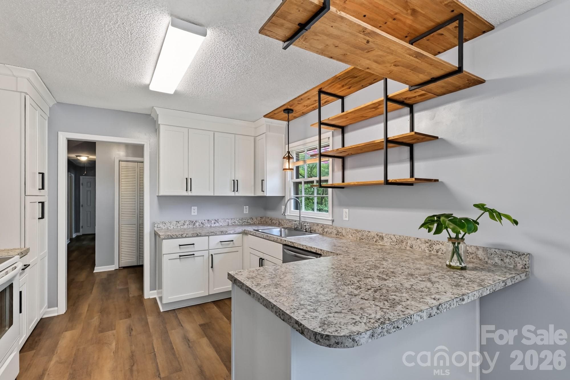 Add some bar stools to the counter! - 1620 Windyrush Lane, Gastonia