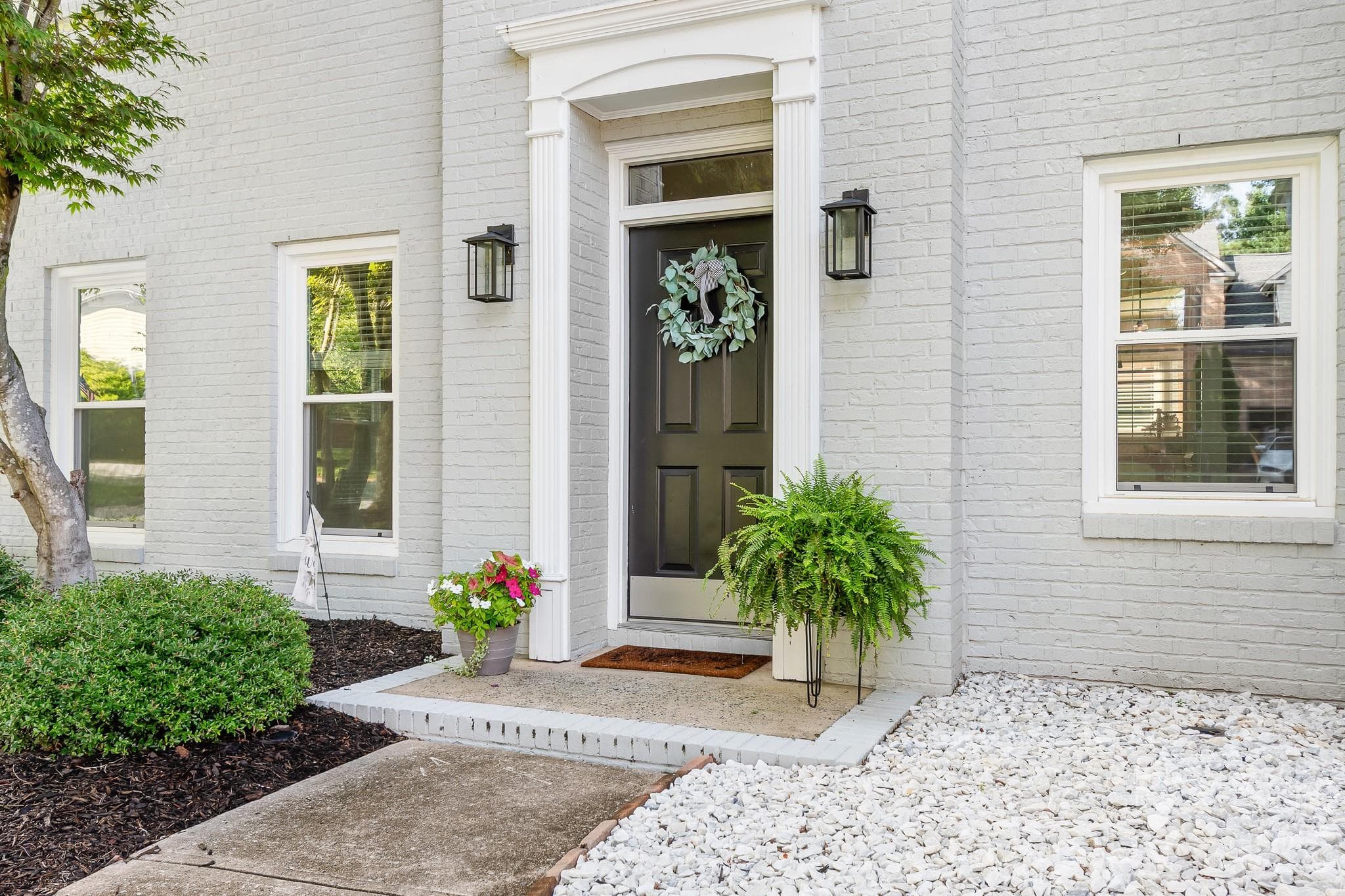 Welcoming front door with low profile entrance. - Cornelius