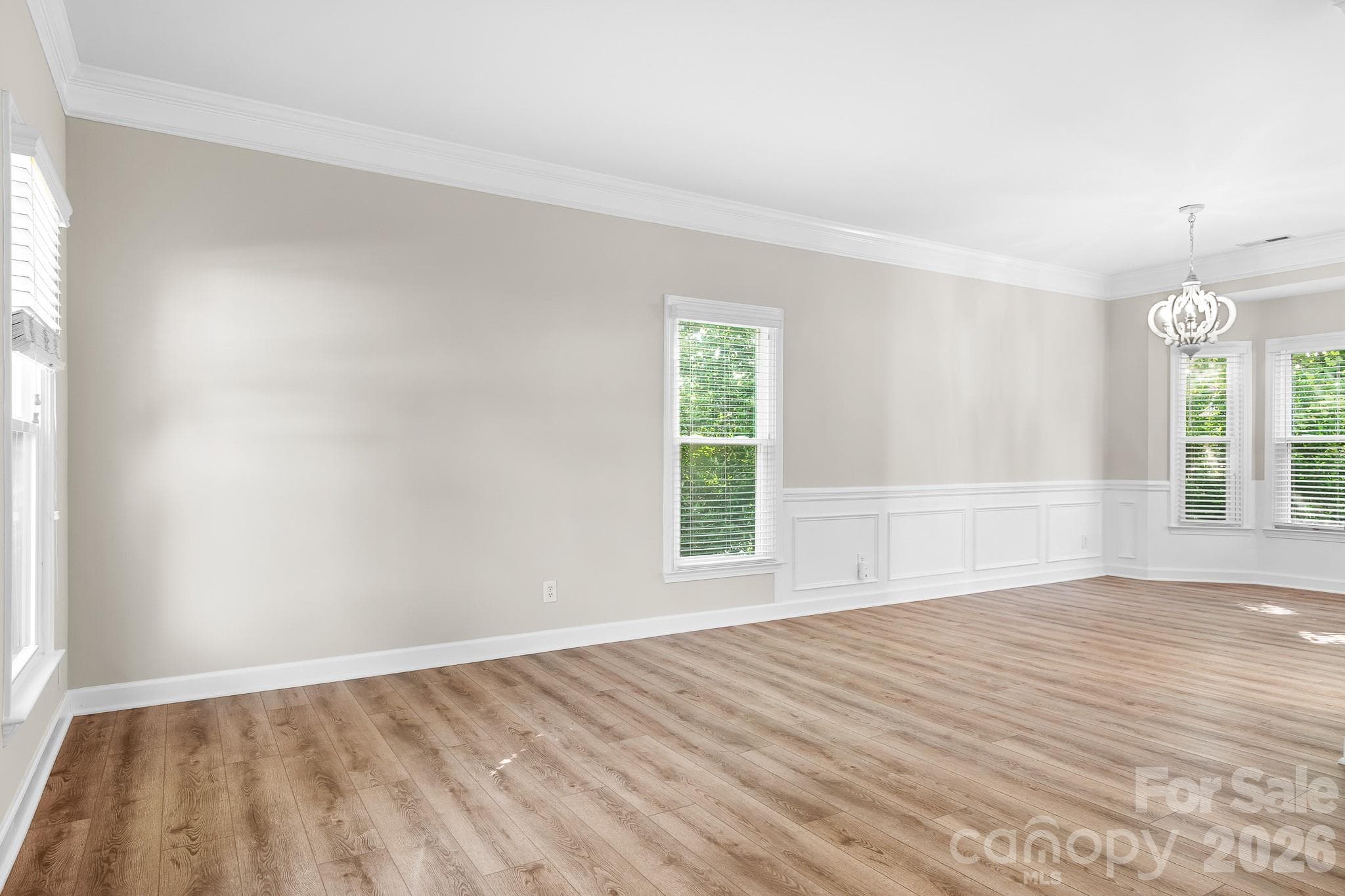 Living and diningRoom. Smooth ceilings, fresh paint and solid LVP flooring throughout. - Cornelius