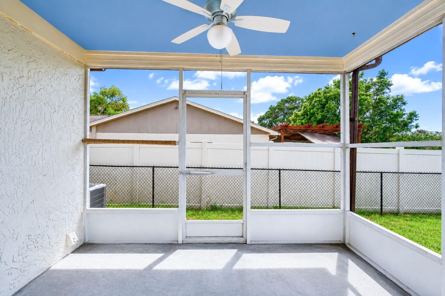 Enclosed patio off one of the bedrooms - 8811 MARTINIQUE LN, PORT RICHEY