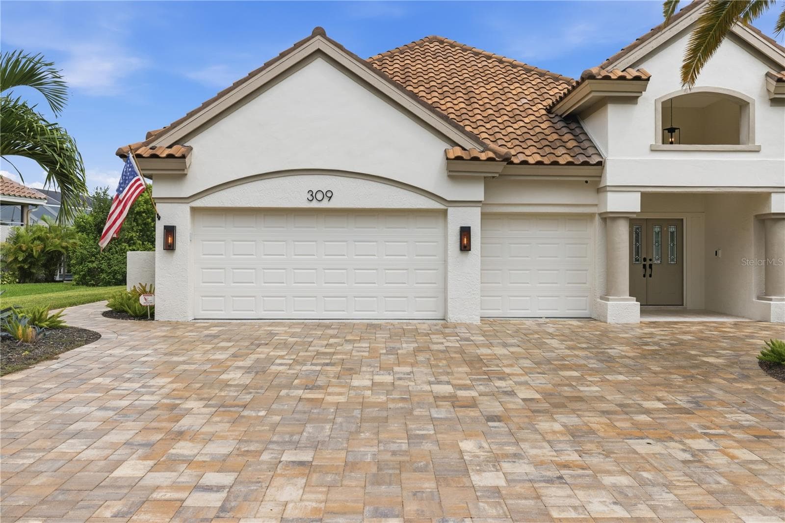 Front of home with 3 car garage shown - 309 S STONE BRIAR CREEK DR, VENICE