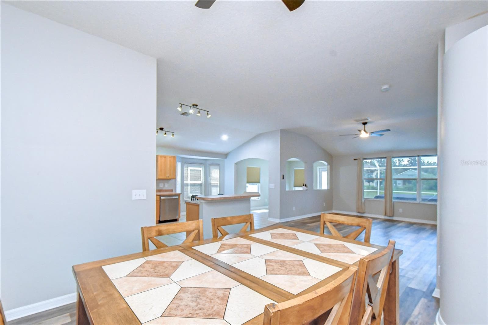 Cozy breakfast nook and dining area with warm wood accents and bright natural light. - 11117 RODEO LN, RIVERVIEW