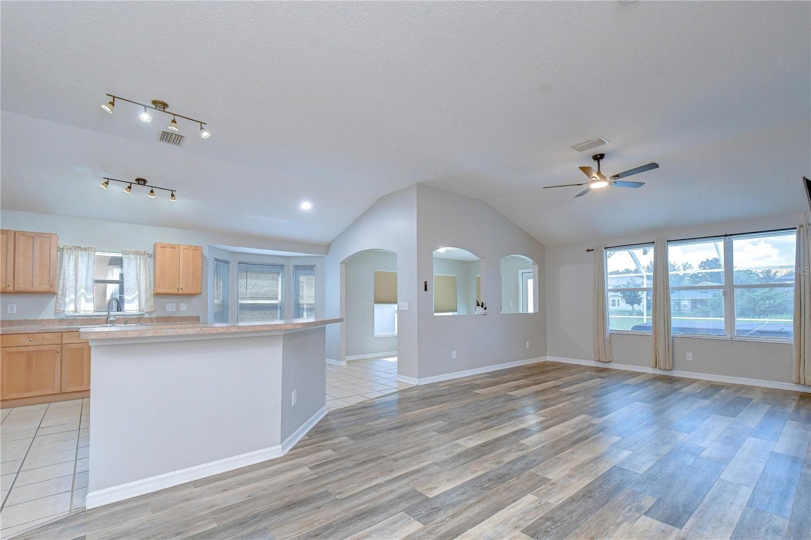 Seamless flow between the living, dining, and kitchen areas creates an ideal setting for everyday living and entertaining. - 11117 RODEO LN, RIVERVIEW