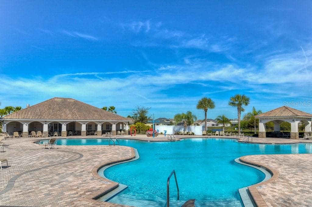 Residents enjoy access to Panther Trace's resort-style community pool and additional neighborhood amenities. - 11117 RODEO LN, RIVERVIEW