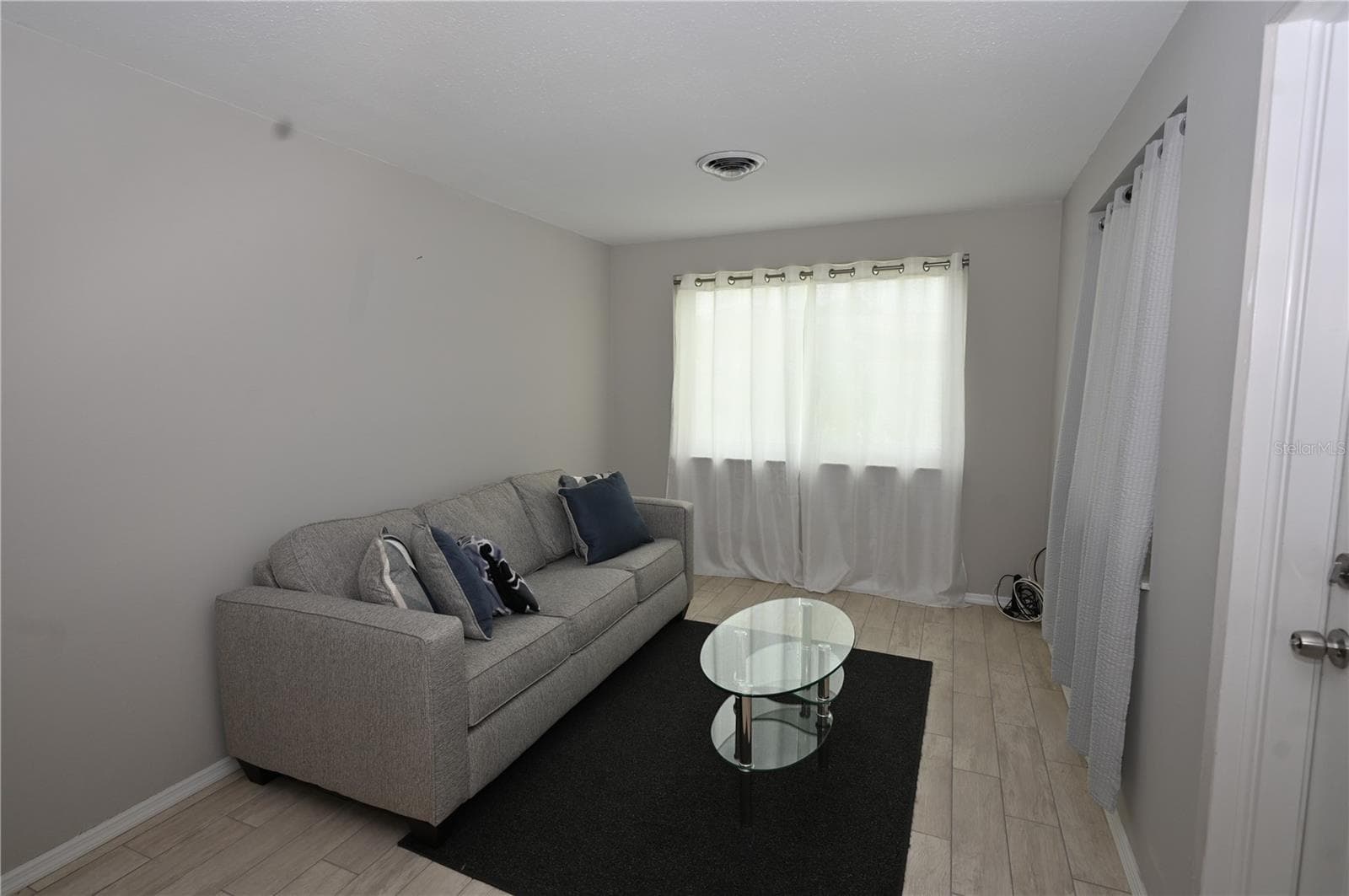 Family room, sofa and table are left for buyers - 1620 MORNING DOVE LN, ENGLEWOOD