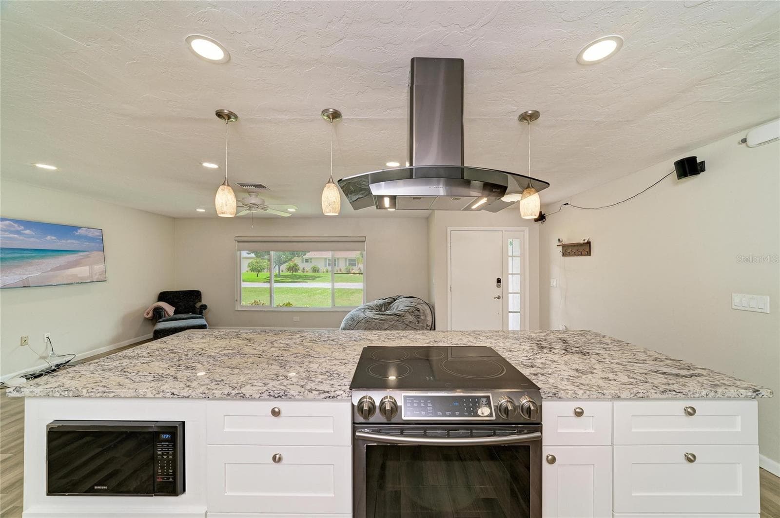 Built-in microwave, range and vent hood in the island. - 2011 37TH ST W, BRADENTON