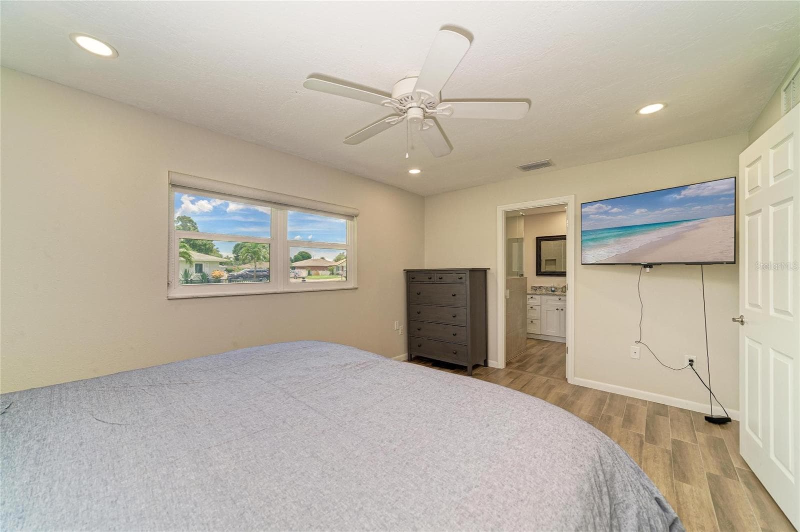 Primary bedroom with ensuite bath. - 2011 37TH ST W, BRADENTON