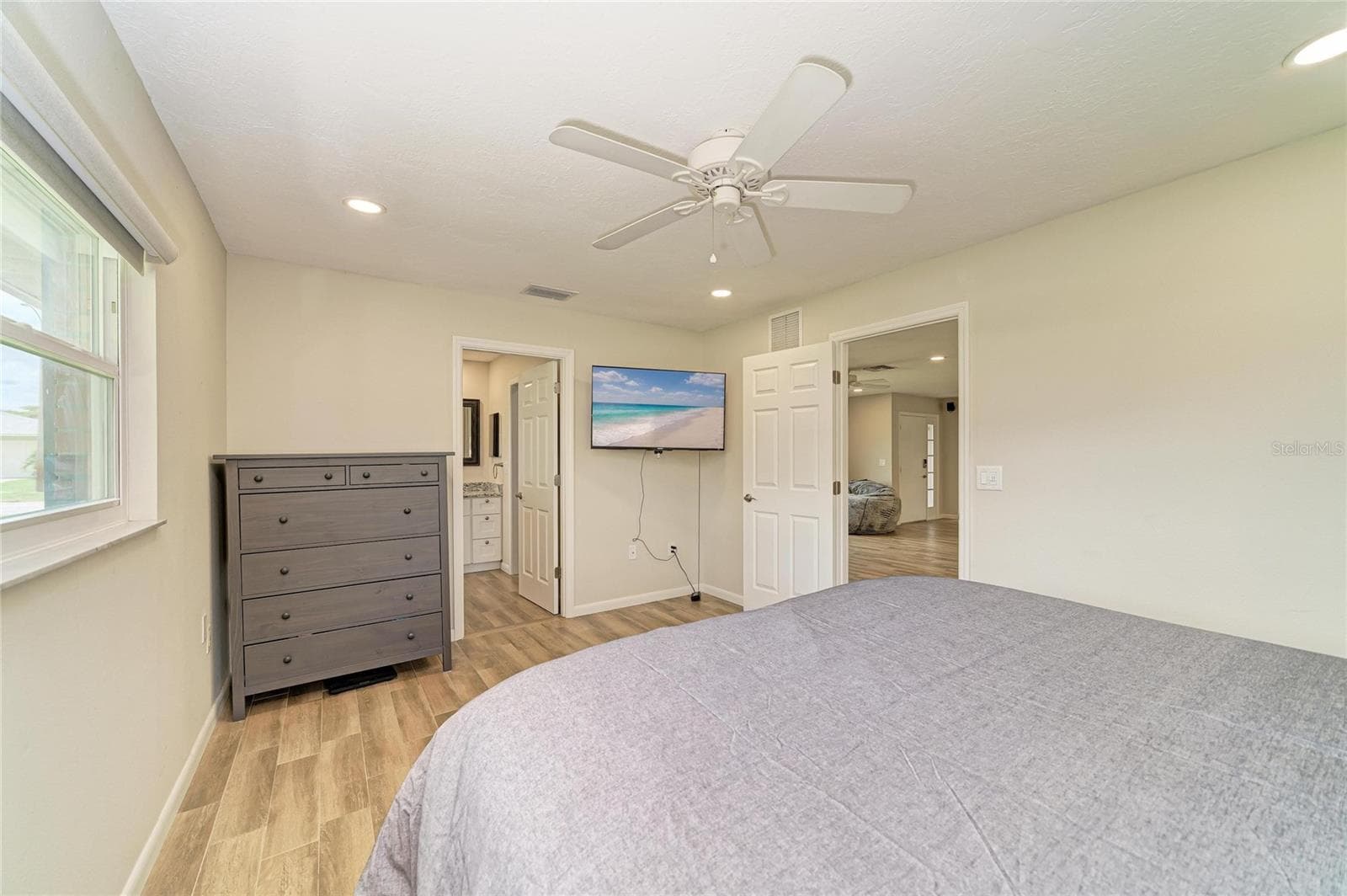 Primary bedroom with ensuite bath. - 2011 37TH ST W, BRADENTON