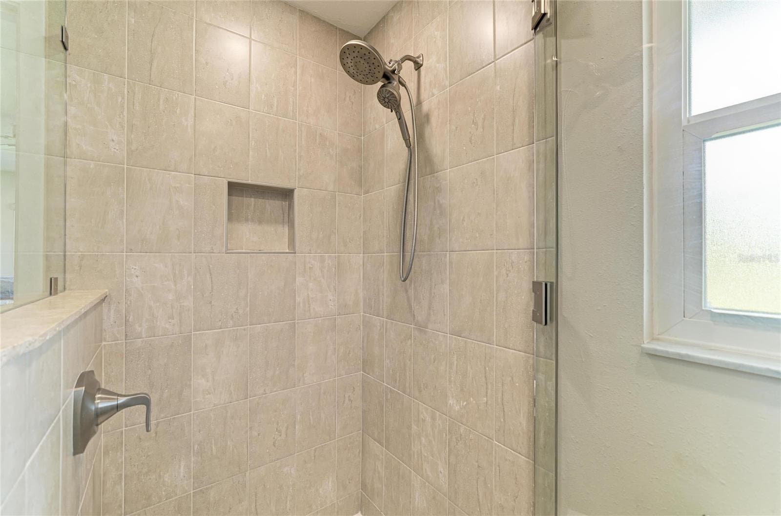 Ensuite bath with walk-in shower, granite counters and walk-in closet. - 2011 37TH ST W, BRADENTON