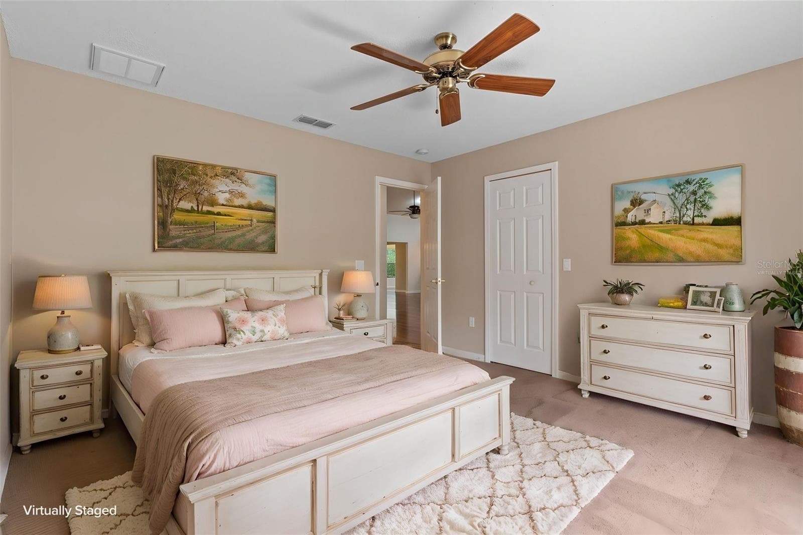 Guest bedroom positioned opposite the primary suite in the split-bedroom floor plan. Virtually staged. - 18055 TARRINGTON PL, HUDSON