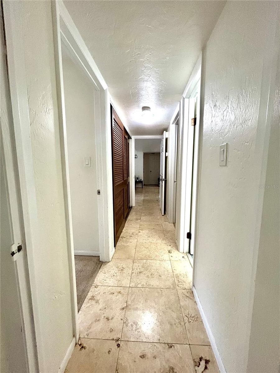 Hallway to Bedrooms and Bathrooms - 407 NW 39TH RD #407C, GAINESVILLE