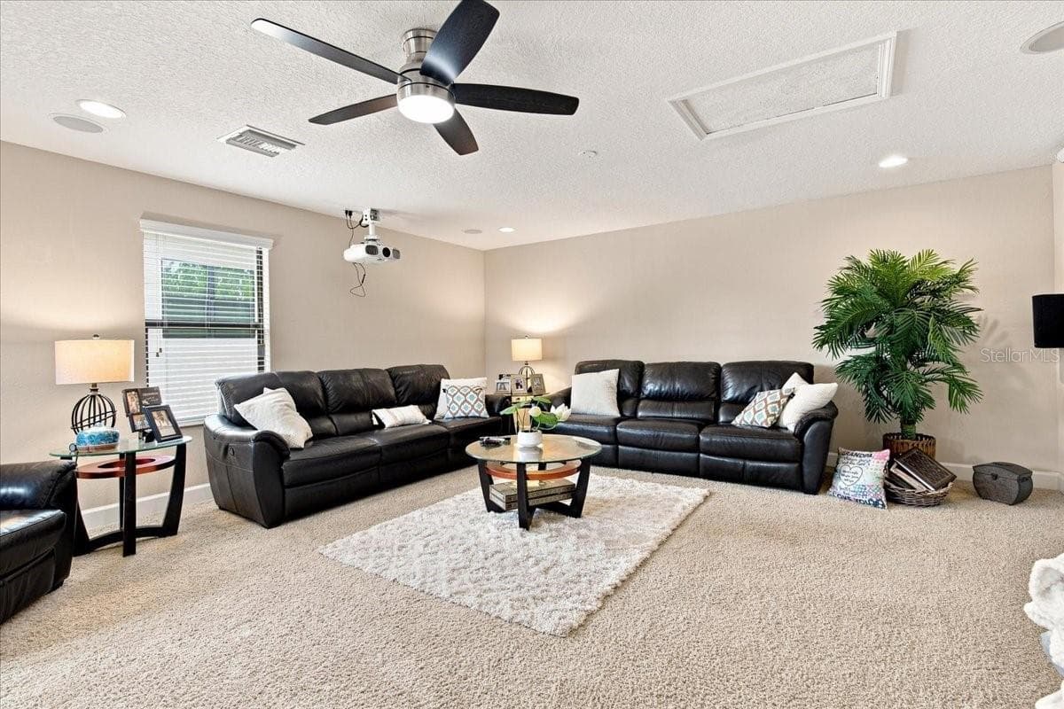 Giant Upstairs Room Currently Being Used as a Movie Room (there is a closet in this room) - 4508 GRAND LAKESIDE DR E, PALM HARBOR