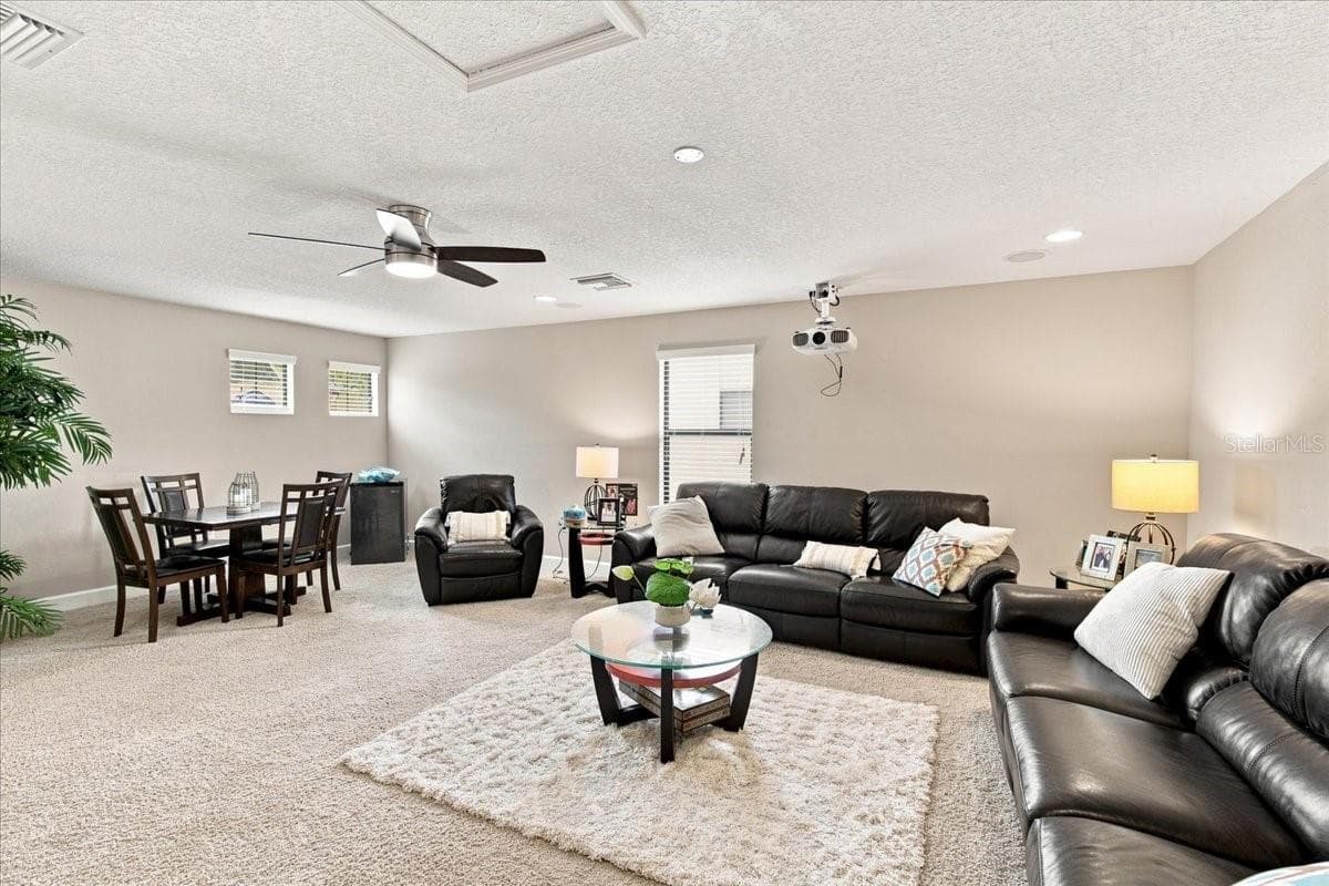 Giant Upstairs Room Currently Being Used as a Movie Room (there is a closet in this room) - 4508 GRAND LAKESIDE DR E, PALM HARBOR