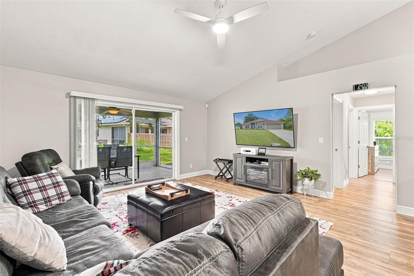 Living Room with High Ceilings, Patio Access & Decorator Plant Shelf - 3695 WAFFLE TER, NORTH PORT