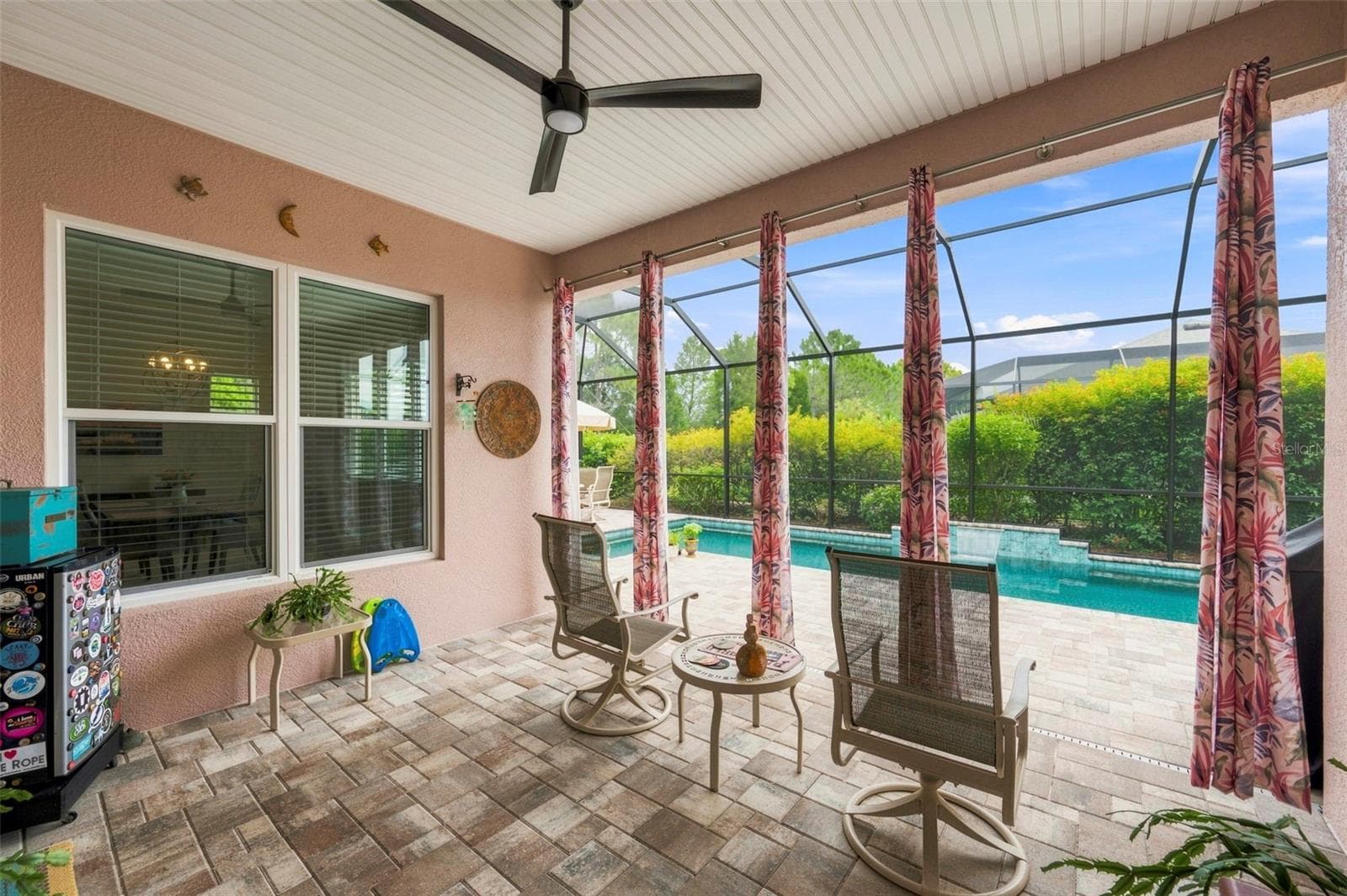 The lanai features a ceiling fan and outdoor electrical outlets - 3850 CREEKSIDE PARK DR, PARRISH