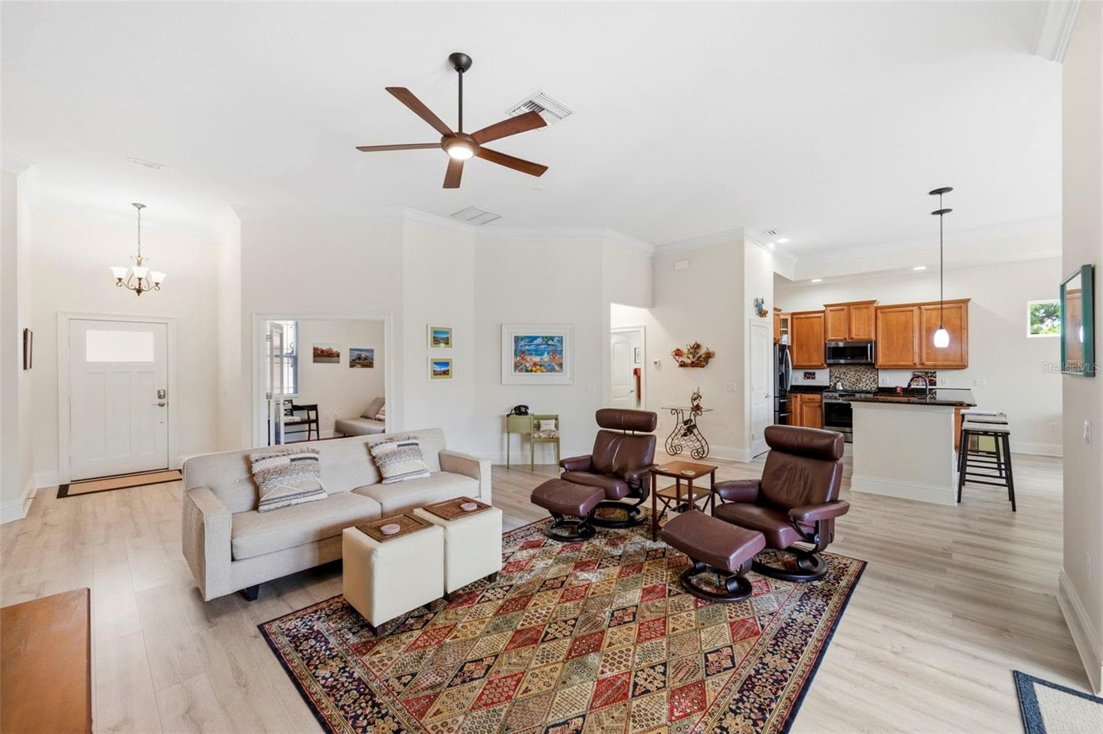 The living space and 3rd bedroom/office feature consistent low maintenance wood plank style flooring - 3850 CREEKSIDE PARK DR, PARRISH