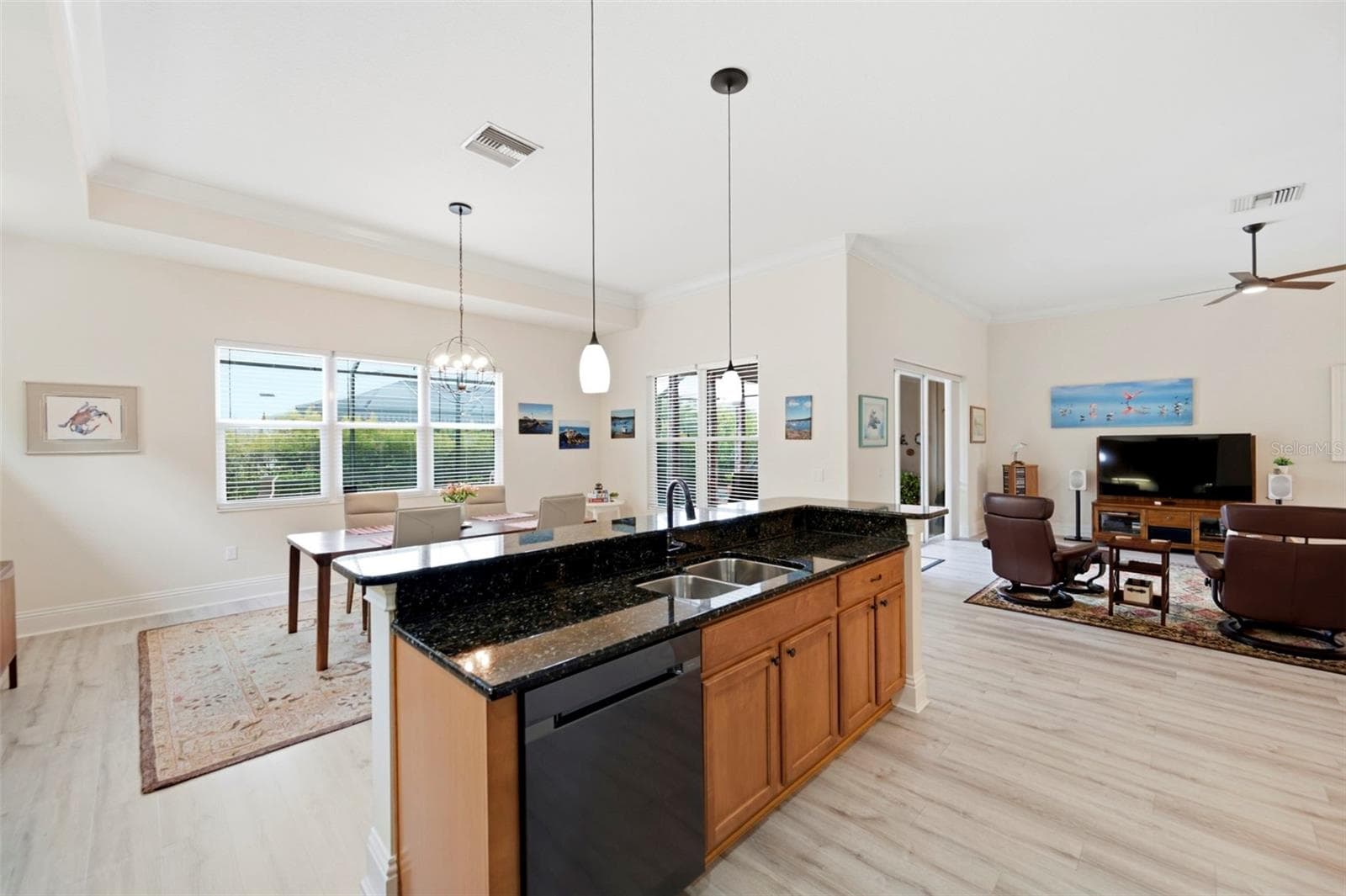 The kitchen is open to the dining room which could also be configured as a family room - 3850 CREEKSIDE PARK DR, PARRISH