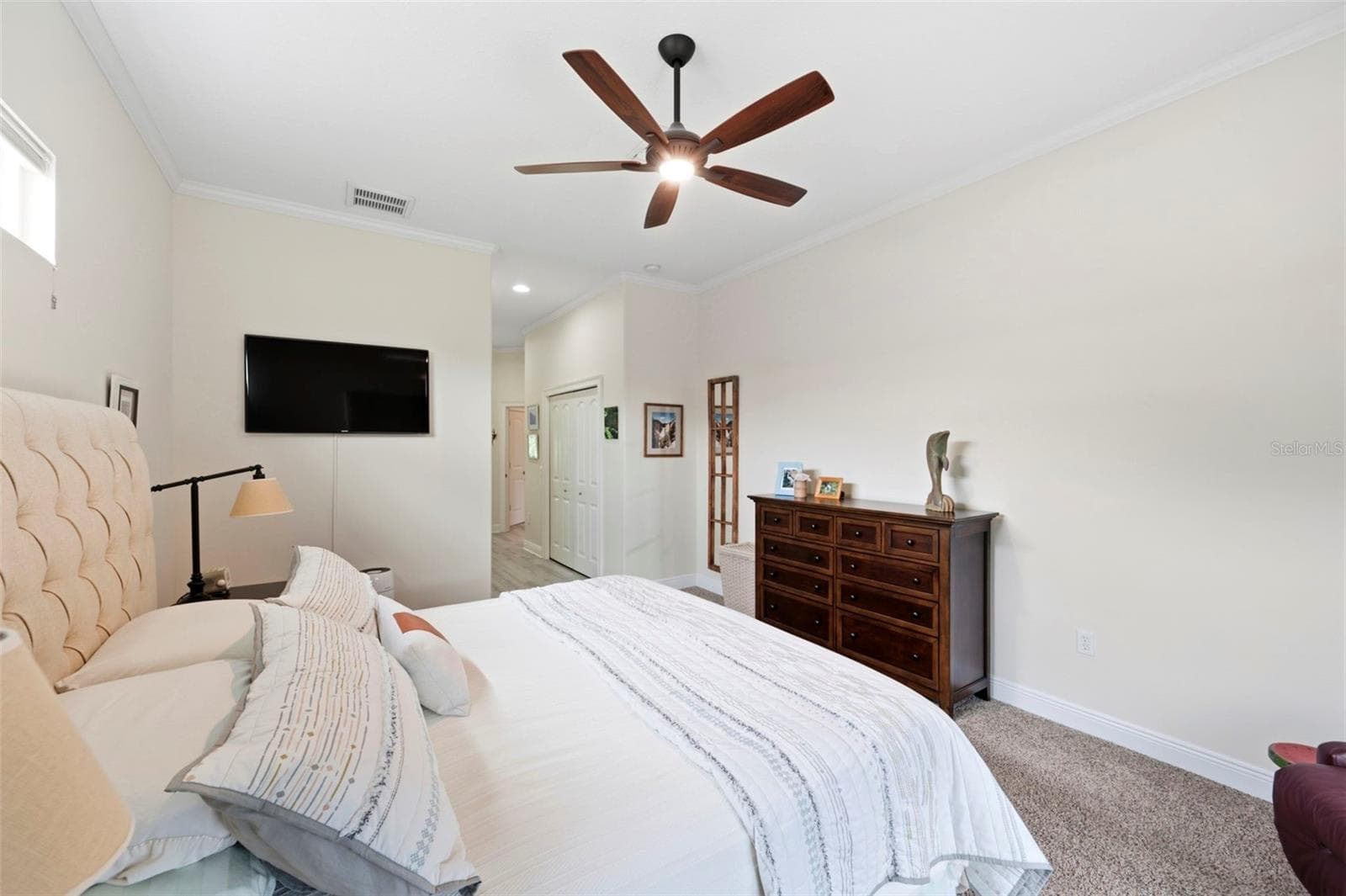 Primary bedroom with low noise high quality Minka DC fan - 3850 CREEKSIDE PARK DR, PARRISH