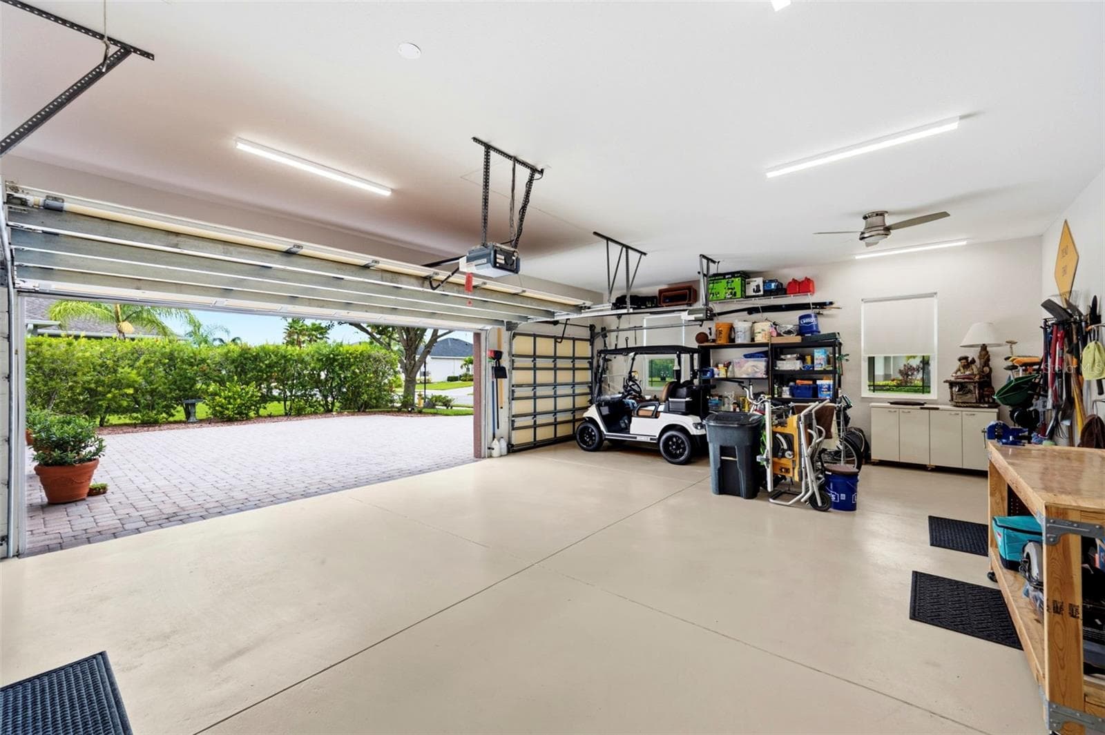 The oversized finished 3 car garage - 3850 CREEKSIDE PARK DR, PARRISH