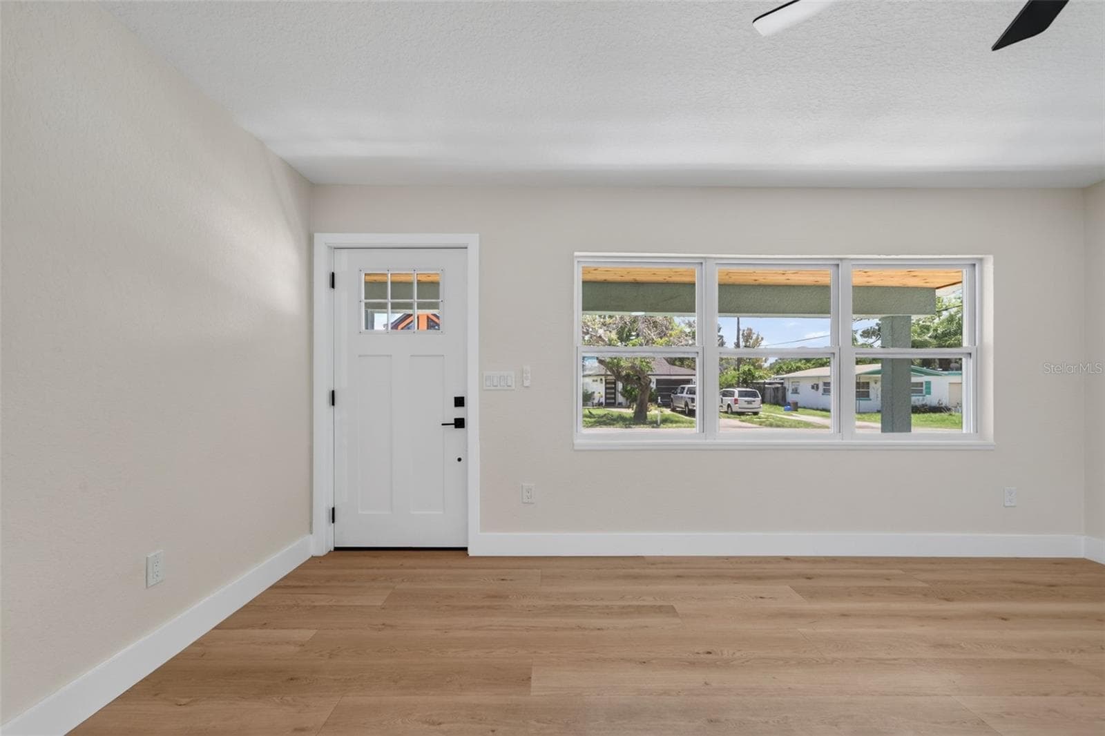 View from the kitchen looking to the front living room windows - 5217 18TH AVE S, GULFPORT