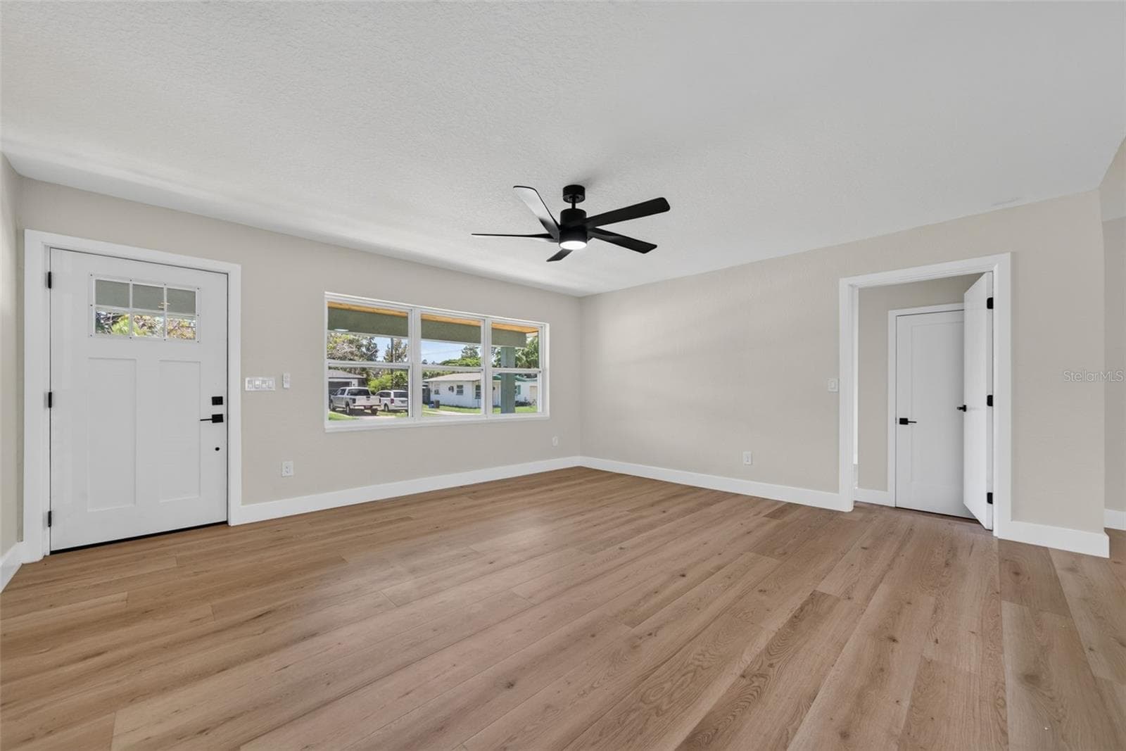 View of Living Room from the hallway. Door leads to 1 of 2 ensuite bedrooms - 5217 18TH AVE S, GULFPORT