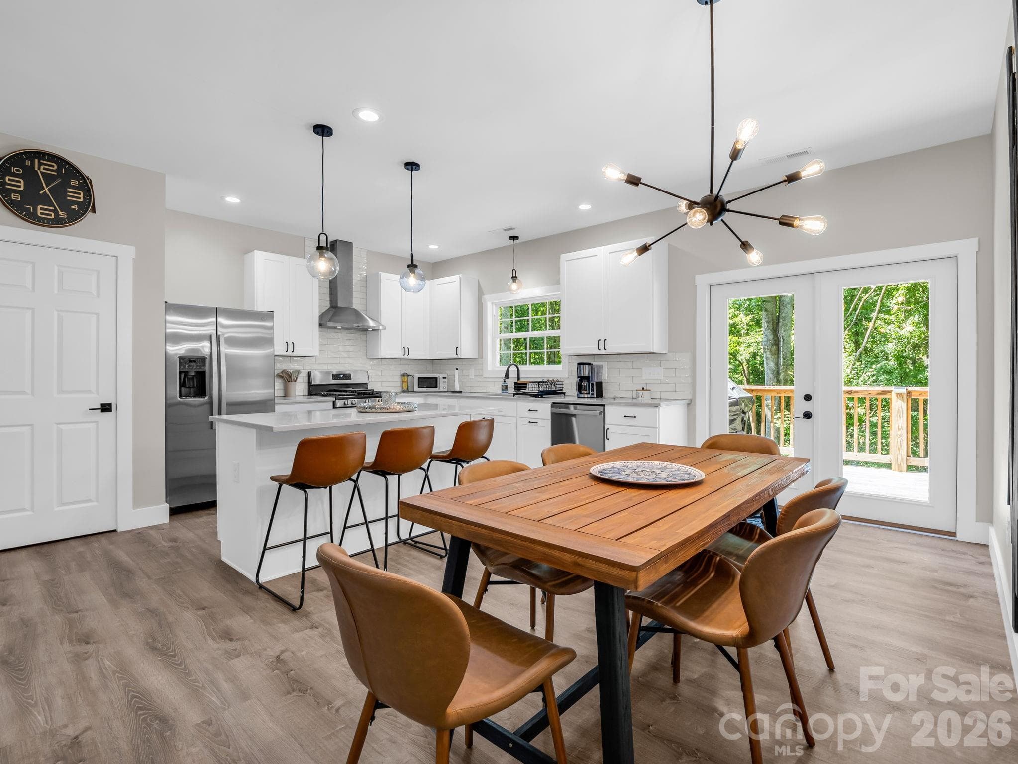 Like new stainless steel appliances convey. The door on the left is the pantry. - 180 Ridgeview Drive, Hendersonville