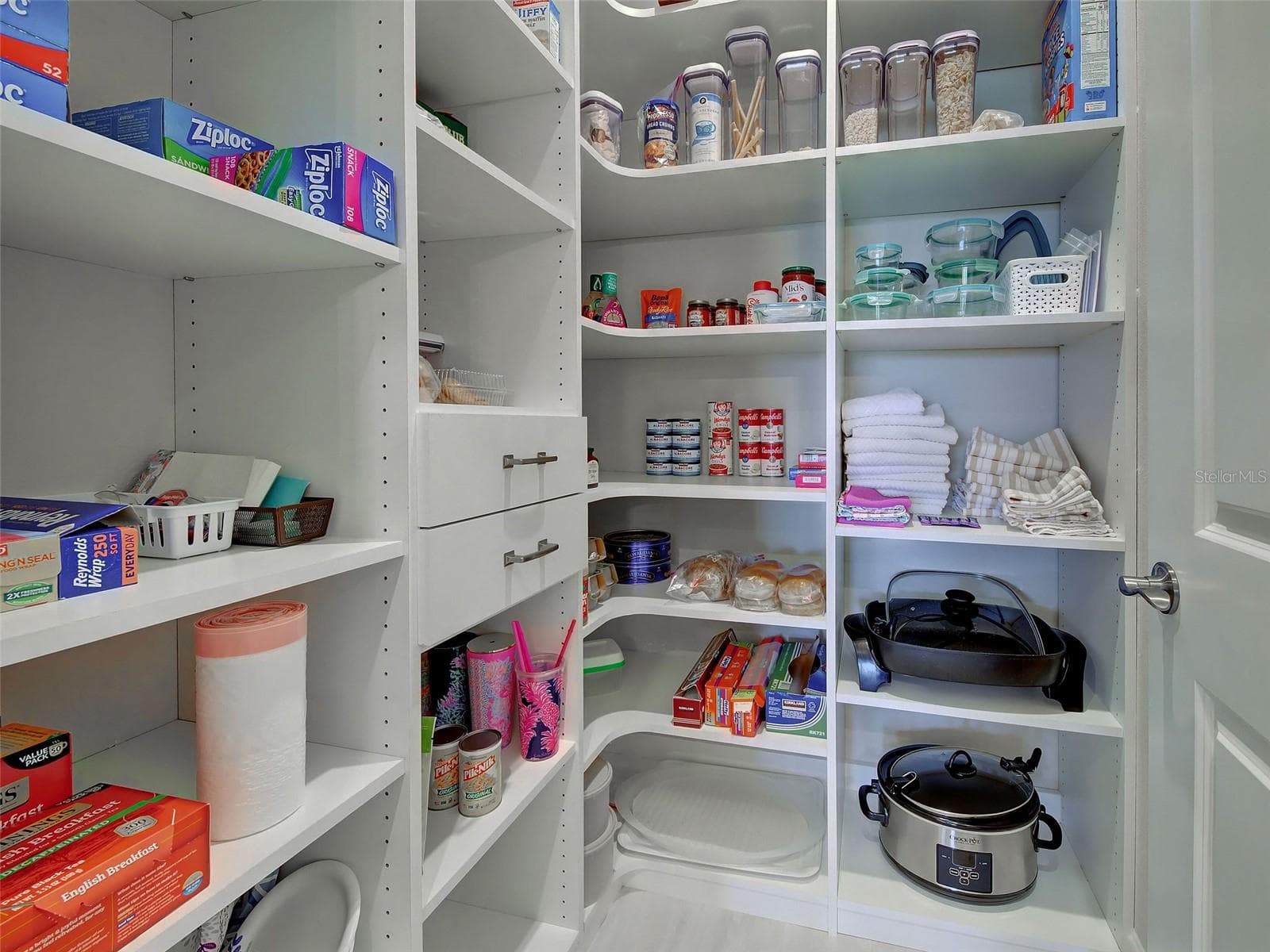 There is a large kitchen pantry. - 5616 SCARLOTTI ST, NOKOMIS